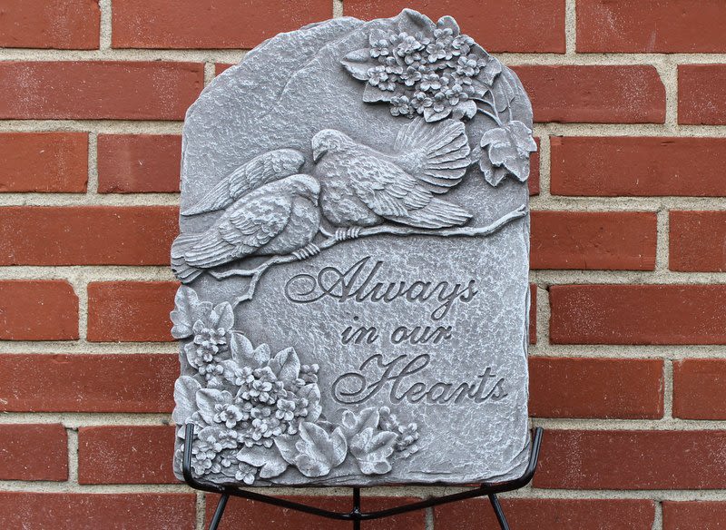 Dove Plaque Dove Plaque - Concrete memorial stone only wrought iron easel stand. Reads "Always in our Hearts" Largest dimension: 18" T