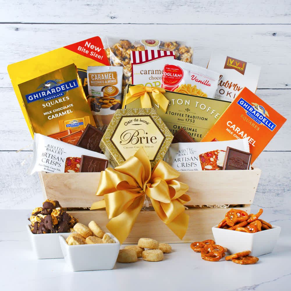 Golden Sweet &amp; Savory Delight Gift Basket - Indulge in the ultimate snacking experience with our Golden Sweet and Savory Delight Gift Basket. This exquisite collection features a delightful assortment of treats, including a bag of rich Ghirardelli chocolate squares, irresistible caramel chocolate popcorn, and crunchy butter toffee pretzels. Savor the unique flavor of caramel macchiato almonds, creamy cheese spread paired with artisan crisps, and the sweet crunch of churro cookies and wafer cookies. To complete this gourmet selection, enjoy the savory goodness of Sonoma cheese crisps. Perfect for any occasion, this thoughtfully curated gift basket is sure to please both sweet and savory palates.  Contents: 1 bag of chocolate squares, caramel chocolate popcorn, butter toffee pretzels, caramel macchiato almonds, cheese spread, artisan crisps qty 2, Ghirardelli chocolate bar, churro cookies, wafer cookie, sonoma cheese crisps, 