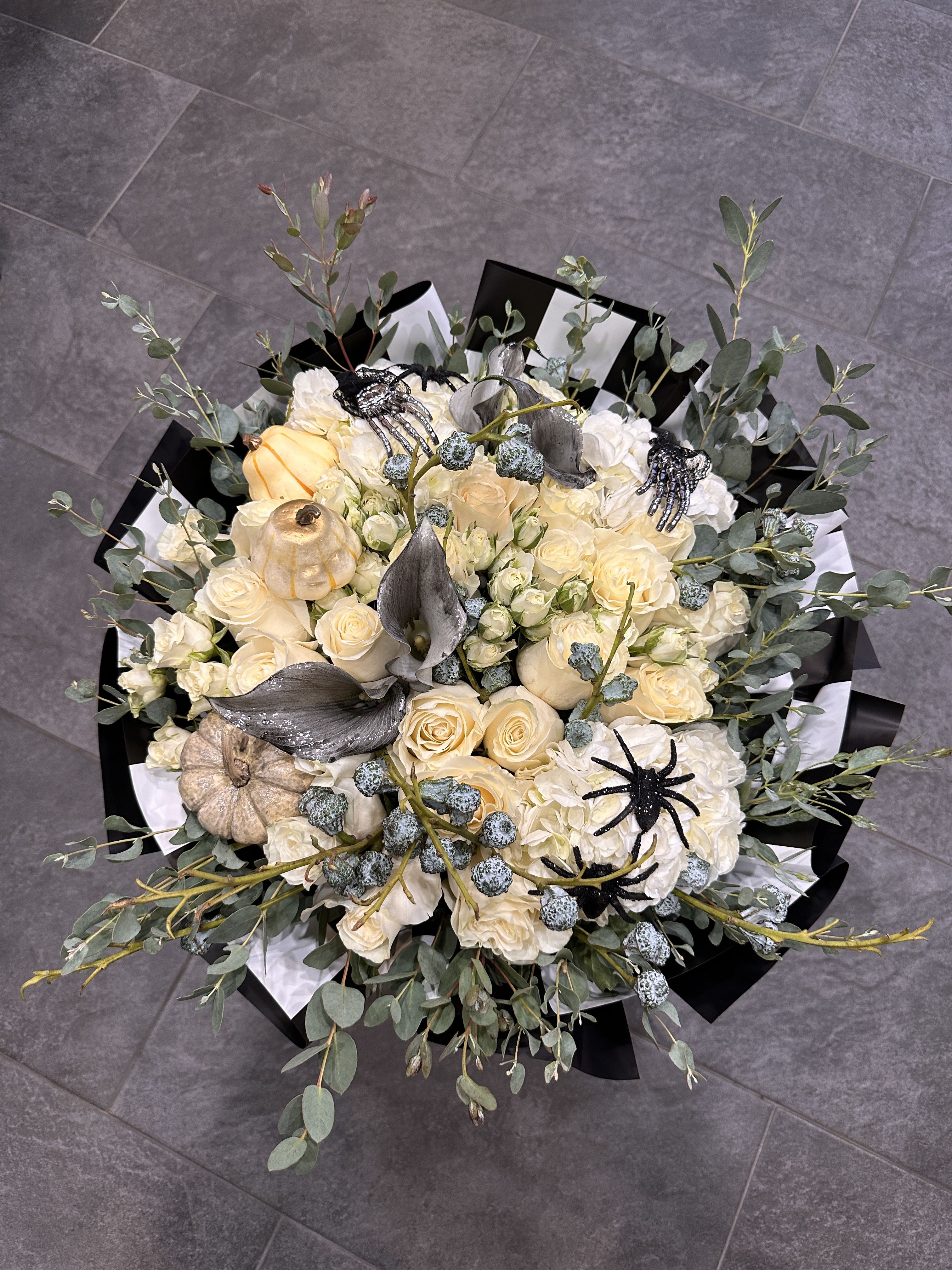 spook season - Brighten any space with our Elegant Flower Bouquet! Bursting with vibrant blooms, this stunning arrangement features seasonal favorites paired with lush greenery for a breathtaking display.  Perfect for any occasion, it makes an ideal gift or a special treat for yourself. Elevate your decor with this captivating bouquet that brings joy and sophistication to your home or office.  Order yours today and let the beauty of flowers inspire you!