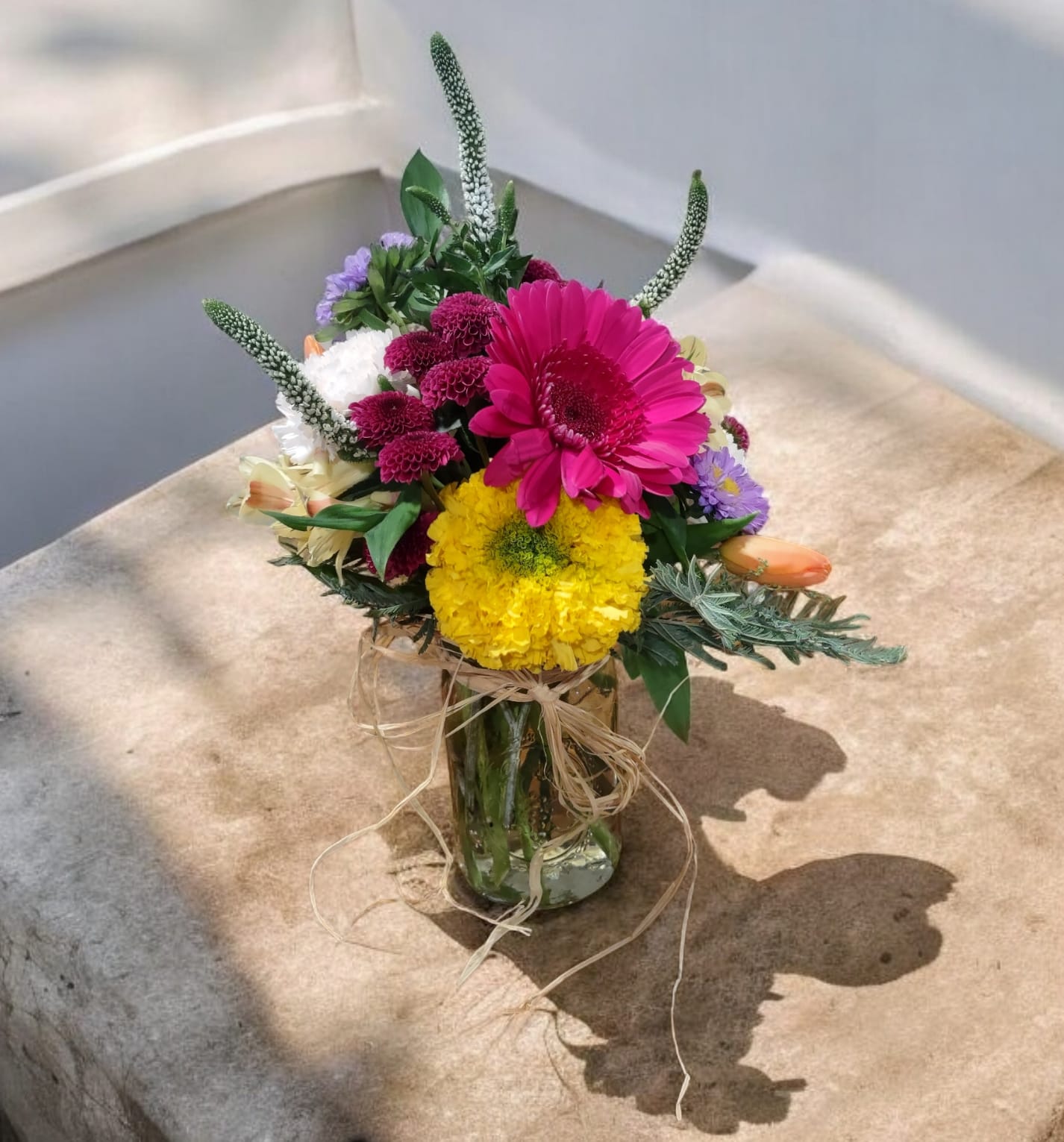 Jar of Joy Jar of Joy - This budget-friendly arrangement is the perfect pick-me-up! With a cheerful mix of fresh blooms, it brings a bright touch to any space. Ideal as a thoughtful gift or to lift your own spirits, it adds a burst of color and joy without breaking the bank!