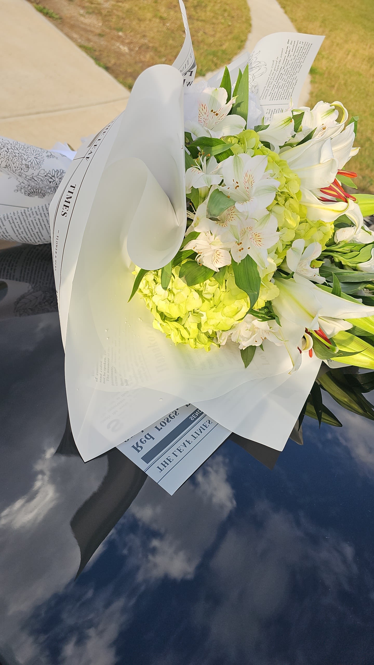Beautiful in White  - This soothing mix of white flowers with green accents is sure to add a touch of softness to your space. 