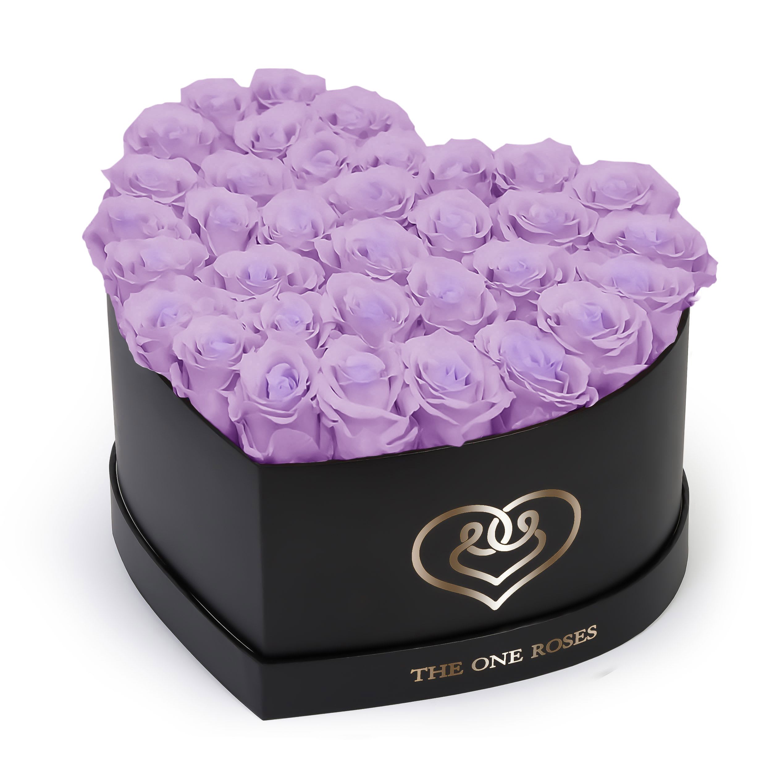 Lilac Roses | Black "Love" Box Lilac Roses | Black "Love" Box - The "heart box collection" consists of unique, real preserved roses handcrafted, soft, and elegant heart box with a top. Luxury arrangement of about 31 stems of the one long lasting (med size) real preserved roses.  Durability: approx. 1-3 years.  Our roses, which are carefully sourced from the highest quality gardens in Ecuador, are made to represent the eternal yet ephemeral nature of Love itself. Our Roses are specially customized with essential oils to increase the fragrance.  Product Care: DO NOT Water the roses! AVOID direct exposure to sunlight. Keep the arrangement in a room-temperature environment. If dust collects after a few months, remove it lightly using a duster. DO NOT place anything onto the roses as they can crush and damage the roses. DO NOT remove the roses from the box; they are secure and happy there. DO NOT allow roses to have direct contact with light colored fabric or surfaces, as staining may occur. The lid is meant to stay on the side or bottom of the box. Be mindful when carrying the arrangement: it's a very delicate product!