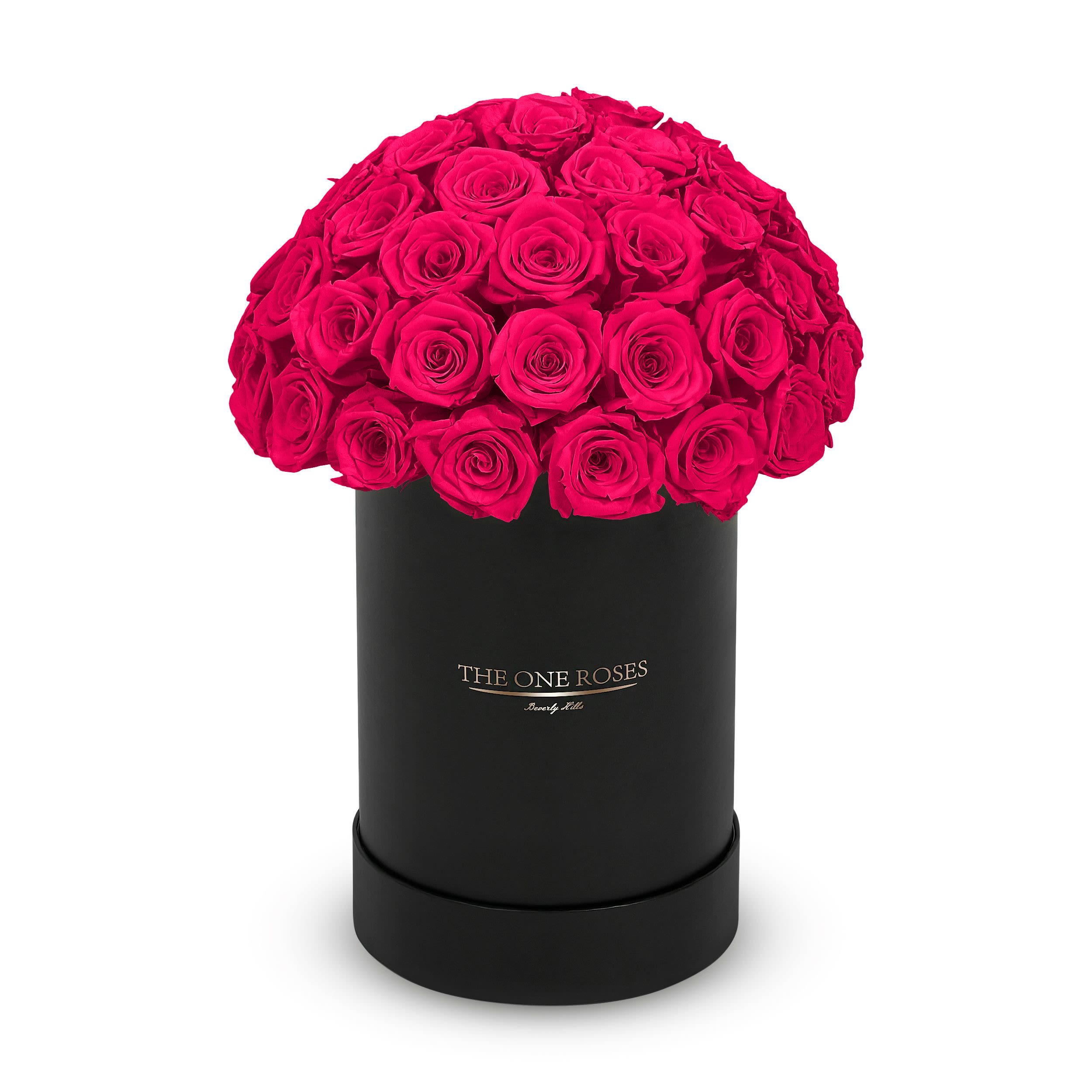 Round Dome | Basic Black Box Hot Pink Round Dome | Basic Black Box Hot Pink - The “Runway Round Collection”. consists of unique, real preserved roses in basic round handcrafted luxury soft touch box with a top. About 40-50 stems of The One long lasting (med size) preserved roses.    Durability: approx. 1-3 years.  Our roses, which are carefully sourced from the highest quality gardens in Ecuador, are made to represent the eternal yet ephemeral nature of Love itself. Our Roses are specially customized with essential oils to increase the fragrance.  Product Care: DO NOT Water the roses! AVOID direct exposure to sunlight. Keep the arrangement in a room-temperature environment. If dust collects after a few months, remove it lightly using a duster. DO NOT place anything onto the roses as they can crush and damage the roses. DO NOT remove the roses from the box; they are secure and happy there. DO NOT allow roses to have direct contact with light colored fabric or surfaces, as staining may occur. The lid is meant to stay on the side or bottom of the box. Be mindful when carrying the arrangement: it's a very delicate product!