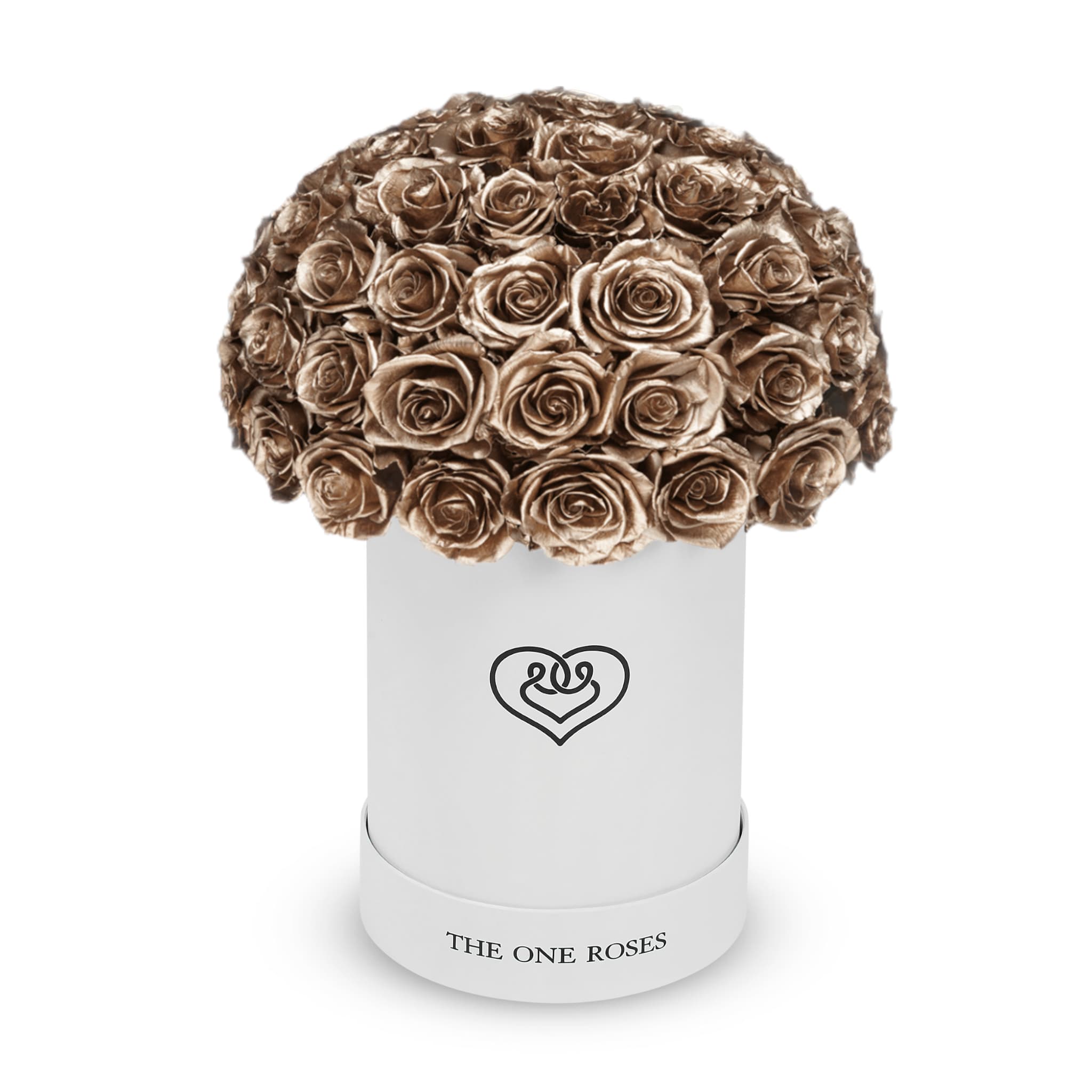 Round Dome | Basic White Box Metallic Gold Round Dome | Basic White Box Metallic Gold - The “Runway Round Collection”. consists of unique, real preserved roses in basic round handcrafted luxury soft touch box with a top. About 50 stems of The One long lasting (med size) preserved roses.  Durability: approx. 1-3 years.  Our roses, which are carefully sourced from the highest quality gardens in Ecuador, are made to represent the eternal yet ephemeral nature of Love itself. Our Roses are specially customized with essential oils to increase the fragrance.  Product Care: DO NOT Water the roses! AVOID direct exposure to sunlight. Keep the arrangement in a room-temperature environment. If dust collects after a few months, remove it lightly using a duster. DO NOT place anything onto the roses as they can crush and damage the roses. DO NOT remove the roses from the box; they are secure and happy there. DO NOT allow roses to have direct contact with light colored fabric or surfaces, as staining may occur. The lid is meant to stay on the side or bottom of the box. Be mindful when carrying the arrangement: it's a very delicate product