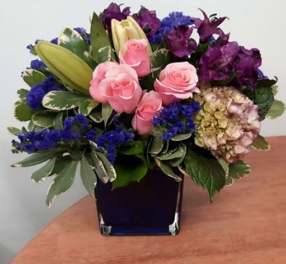 Enchanted Pearl Garden Enchanted Pearl Garden - This elegant, modern creation flaunts an array of pink spray roses, white asiatic lilies, vibrant purple alstroemeria and statice, hydrangea and lush greenery. Artistically designed in an indigo colored cube for a chic presentation. Available for same day delivery by Denver's Best Florist, Floral Expressions!