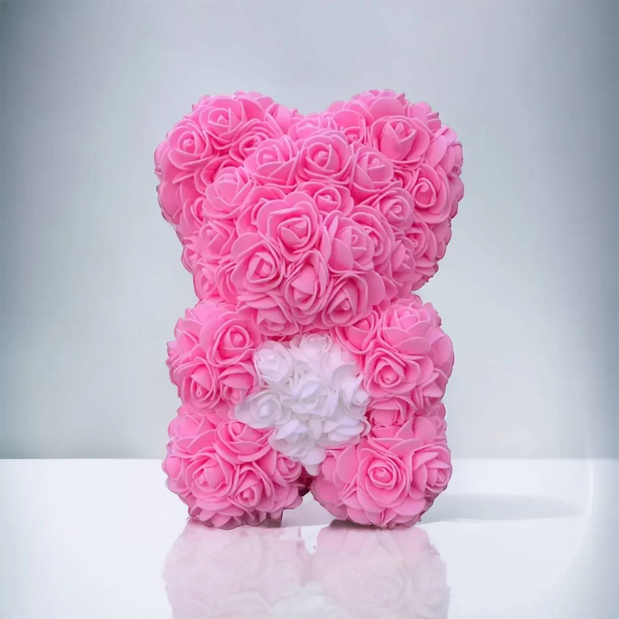Small Rose Bear Pink White Small Rose Bear Pink White - Instantly charming, The One Roses Rose Bear is brimming with color and character. Pops of bright, recreated florals are perfectly arranged into the beloved shape of a teddy. The Bear is carefully handmade with perfectly replicated artificial florals that feature realistic botanical details. A heartfelt gift that leaves nothing wanting, our Rose Bear immediately uplifts mood and elevates home decor, making it fit for all celebrations. Item Dimensions: 9.4" x 7.1" x 6.7" (Small)