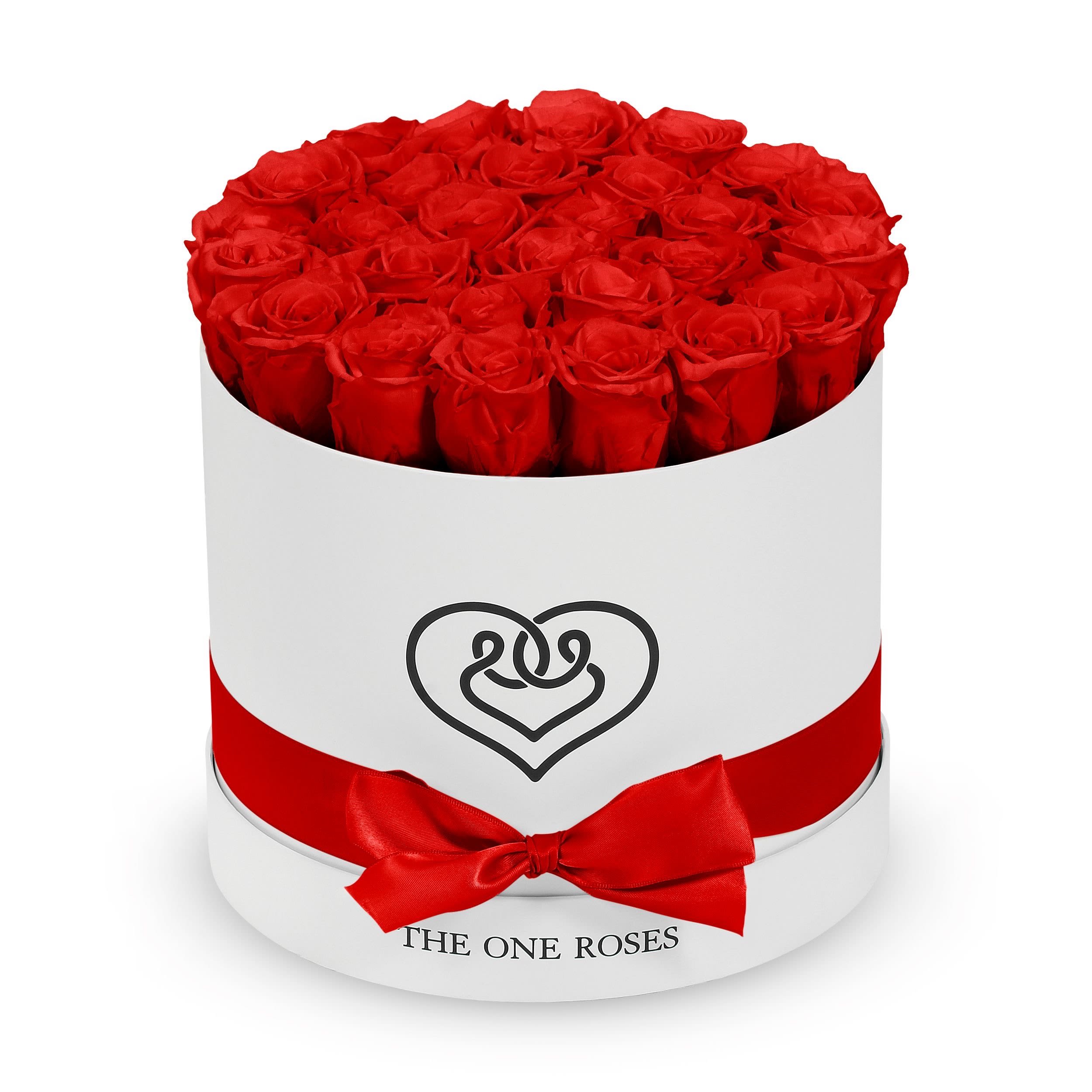 Round Flat | Classic White Box Crimson Red Round Flat | Classic White Box Crimson Red - The "runway round collection" consists of unique, real preserved roses in classic round handcrafted luxury soft touch box with a top. About 25-30 stems of the one long lasting (med size) preserved roses.  Durability: approx. 1-3 years.  Our roses, which are carefully sourced from the highest quality gardens in Ecuador, are made to represent the eternal yet ephemeral nature of Love itself. Our Roses are specially customized with essential oils to increase the fragrance.  Product Care: DO NOT Water the roses! AVOID direct exposure to sunlight. Keep the arrangement in a room-temperature environment. If dust collects after a few months, remove it lightly using a duster. DO NOT place anything onto the roses as they can crush and damage the roses. DO NOT remove the roses from the box; they are secure and happy there. DO NOT allow roses to have direct contact with light colored fabric or surfaces, as staining may occur. The lid is meant to stay on the side or bottom of the box. Be mindful when carrying the arrangement: it's a very delicate product!