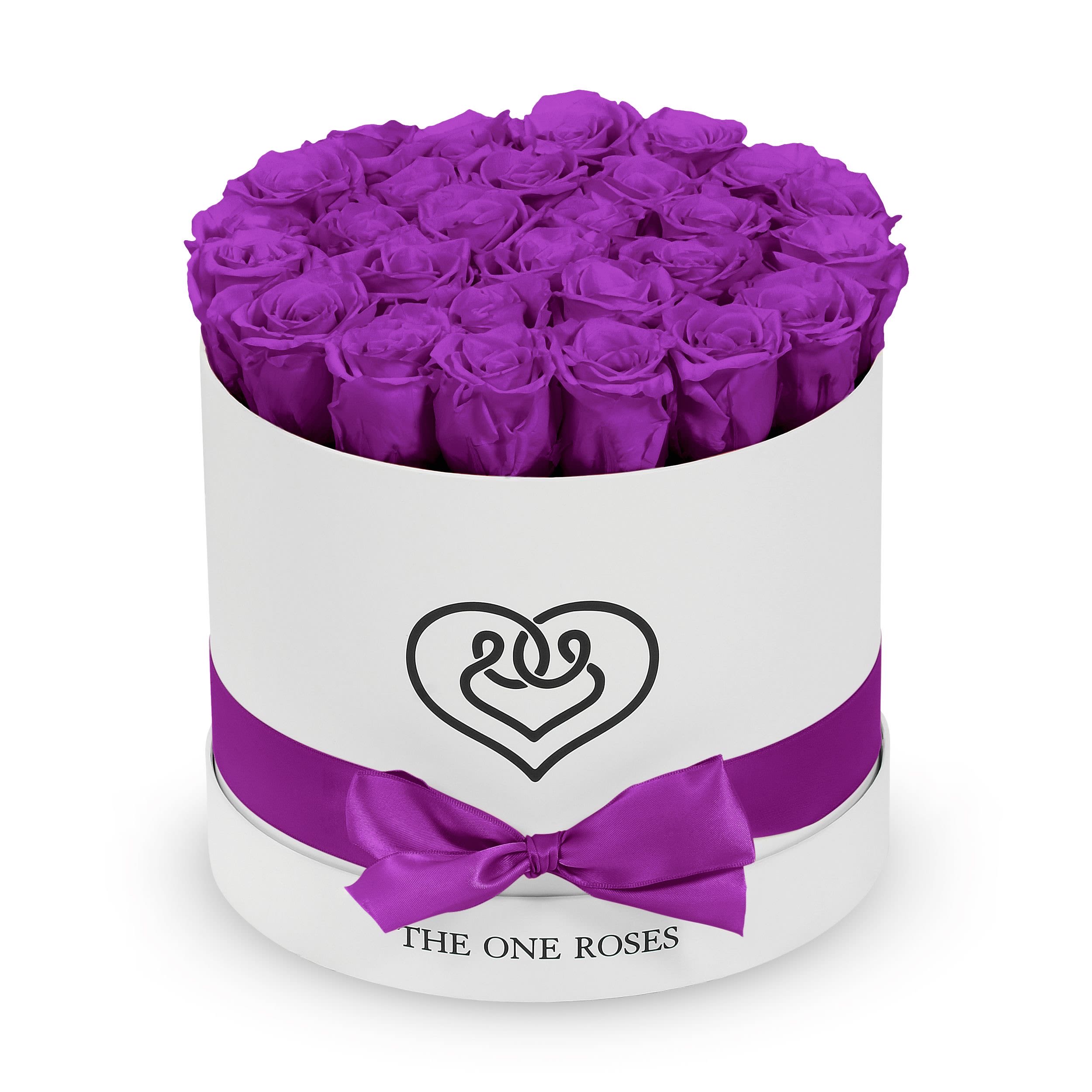 Round Flat | Classic White Box Purple Round Flat | Classic White Box Purple - The "runway round collection" consists of unique, real preserved roses in classic round handcrafted luxury soft touch box with a top. About 25-30 stems of the one long lasting (med size) preserved roses.  Durability: approx. 1-3 years.  Our roses, which are carefully sourced from the highest quality gardens in Ecuador, are made to represent the eternal yet ephemeral nature of Love itself. Our Roses are specially customized with essential oils to increase the fragrance.  Product Care: DO NOT Water the roses! AVOID direct exposure to sunlight. Keep the arrangement in a room-temperature environment. If dust collects after a few months, remove it lightly using a duster. DO NOT place anything onto the roses as they can crush and damage the roses. DO NOT remove the roses from the box; they are secure and happy there. DO NOT allow roses to have direct contact with light colored fabric or surfaces, as staining may occur. The lid is meant to stay on the side or bottom of the box. Be mindful when carrying the arrangement: it's a very delicate product!