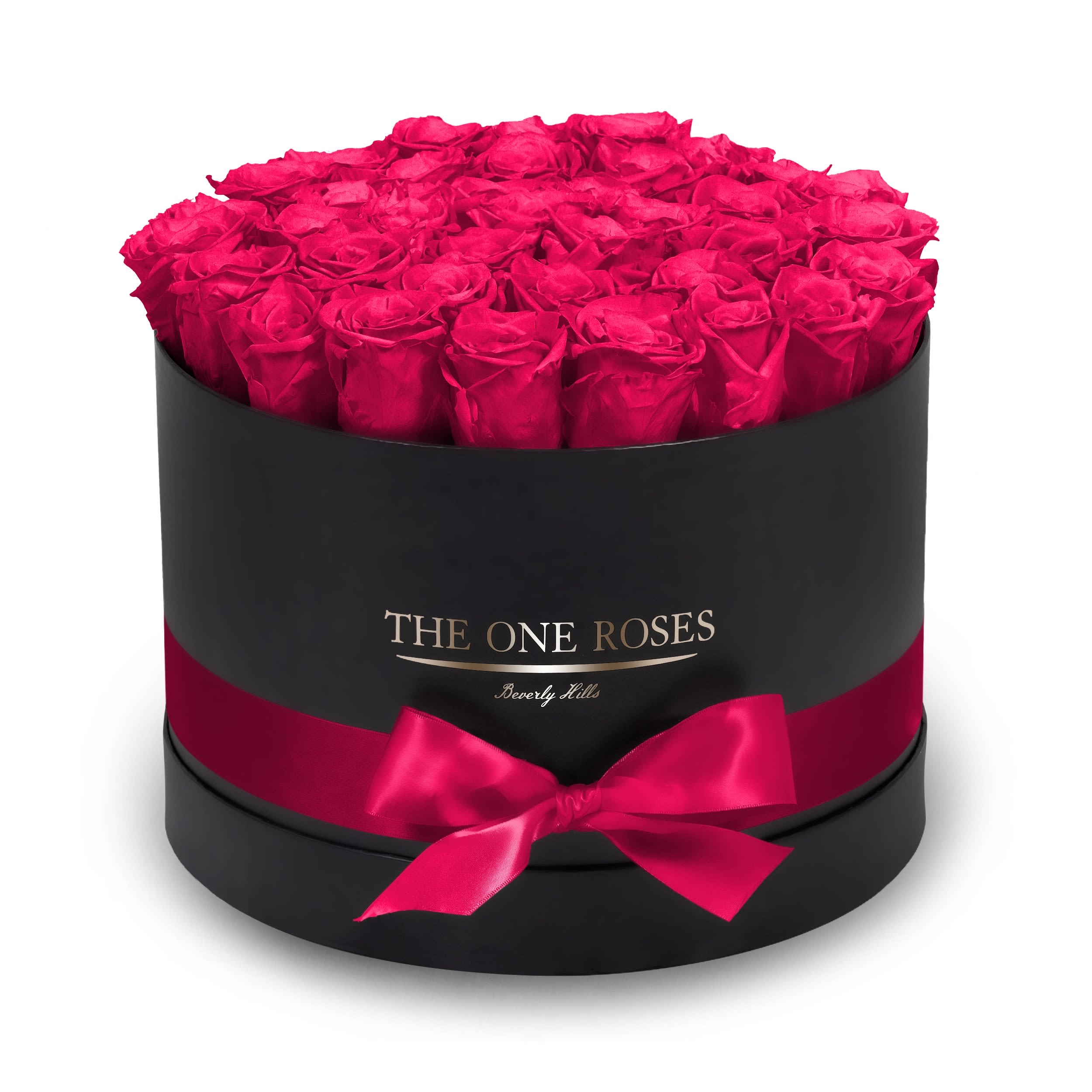 Round Flat | Premium Black Box Hot Pink Round Flat | Premium Black Box Hot Pink - The “Runway Round Collection”. consists of unique, real preserved roses in premium round handcrafted luxury soft touch box with a top. About 30-36 stems of The One long lasting (med size) preserved roses.  Durability: approx. 1-3 years.  Our roses, which are carefully sourced from the highest quality gardens in Ecuador, are made to represent the eternal yet ephemeral nature of Love itself. Our Roses are specially customized with essential oils to increase the fragrance.  Product Care: DO NOT Water the roses! AVOID direct exposure to sunlight. Keep the arrangement in a room-temperature environment. If dust collects after a few months, remove it lightly using a duster. DO NOT place anything onto the roses as they can crush and damage the roses. DO NOT remove the roses from the box; they are secure and happy there. DO NOT allow roses to have direct contact with light colored fabric or surfaces, as staining may occur. The lid is meant to stay on the side or bottom of the box. Be mindful when carrying the arrangement: it's a very delicate product!