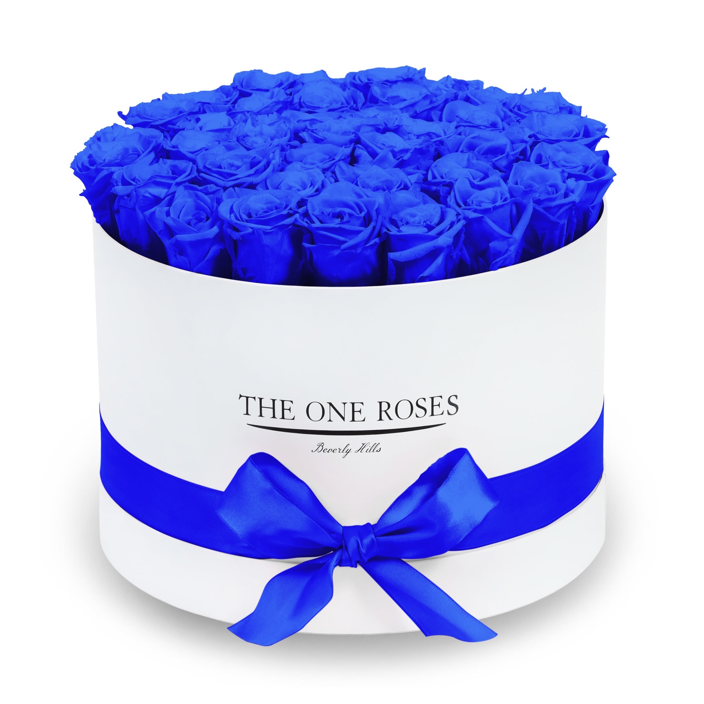 Round Flat | Premium White Box Sapphire Blue Round Flat | Premium White Box Sapphire Blue - The “Runway Round Collection”. consists of unique, real preserved roses in premium round handcrafted luxury soft touch box with a top. About 30-36 stems of The One long lasting (med size) preserved roses.  Durability: approx. 1-3 years.  Our roses, which are carefully sourced from the highest quality gardens in Ecuador, are made to represent the eternal yet ephemeral nature of Love itself. Our Roses are specially customized with essential oils to increase the fragrance.  Product Care: DO NOT Water the roses! AVOID direct exposure to sunlight. Keep the arrangement in a room-temperature environment. If dust collects after a few months, remove it lightly using a duster. DO NOT place anything onto the roses as they can crush and damage the roses. DO NOT remove the roses from the box; they are secure and happy there. DO NOT allow roses to have direct contact with light colored fabric or surfaces, as staining may occur. The lid is meant to stay on the side or bottom of the box. Be mindful when carrying the arrangement: it's a very delicate product!