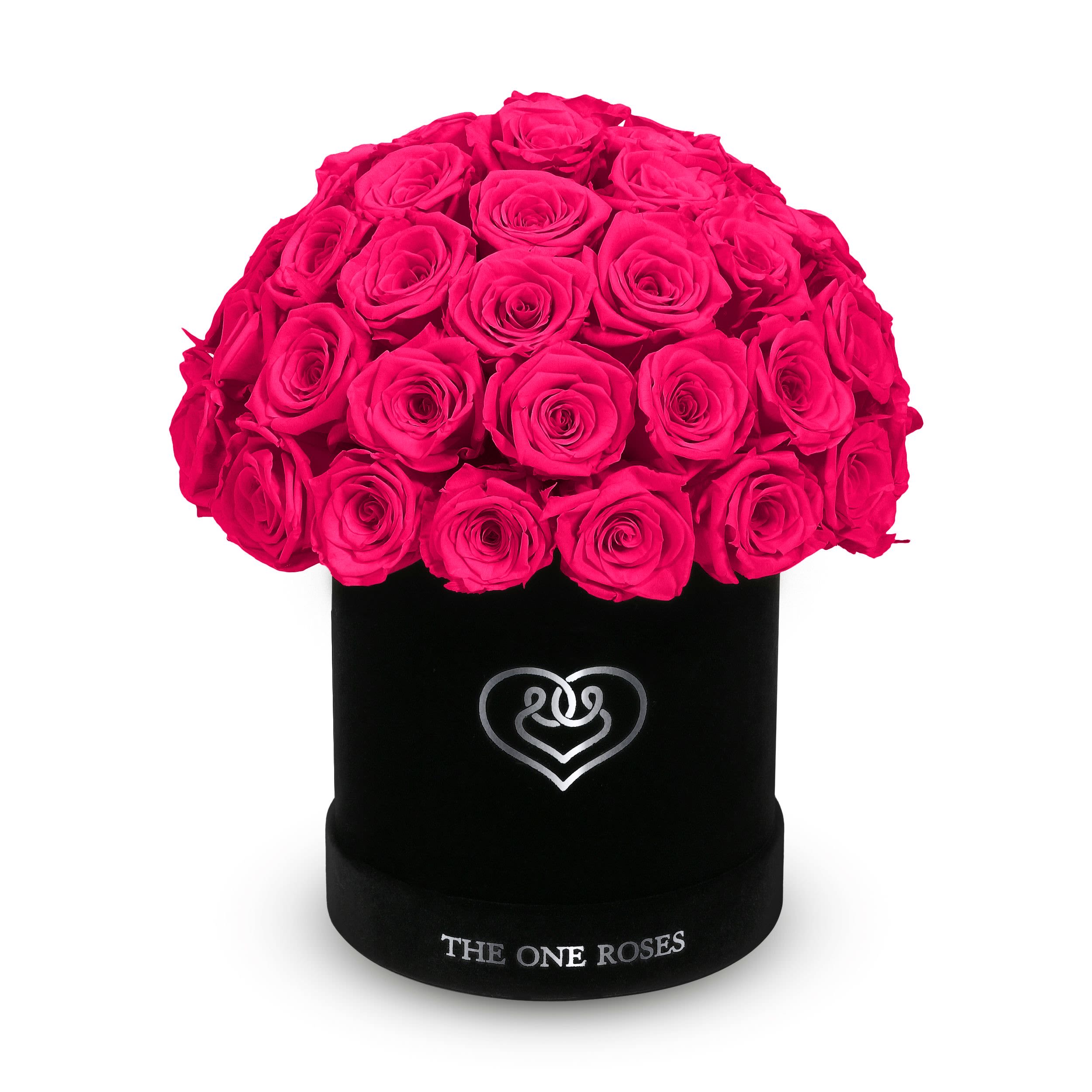 Suede Dome | Basic Black Box Hot Pink Suede Dome | Basic Black Box Hot Pink - The One Roses “Suede Collection“ consists of unique, real preserved roses in basic round handcrafted luxury black suede box with a top.  With about 50 stems of The One long lasting (med size) real preserved roses.  Durability: approx. 1-3 years.  Product Dimension: 6″× 6″ / ABOUT 50 ROSES  Our roses, which are carefully sourced from the highest quality gardens in Ecuador, are made to represent the eternal yet ephemeral nature of Love itself. Our Roses are specially customized with essential oils to increase the fragrance.  Product Care: DO NOT Water the roses! AVOID direct exposure to sunlight. Keep the arrangement in a room-temperature environment. If dust collects after a few months, remove it lightly using a duster. DO NOT place anything onto the roses as they can crush and damage the roses. DO NOT remove the roses from the box; they are secure and happy there. DO NOT allow roses to have direct contact with light colored fabric or surfaces, as staining may occur. The lid is meant to stay on the side or bottom of the box. Be mindful when carrying the arrangement: it's a very delicate product!