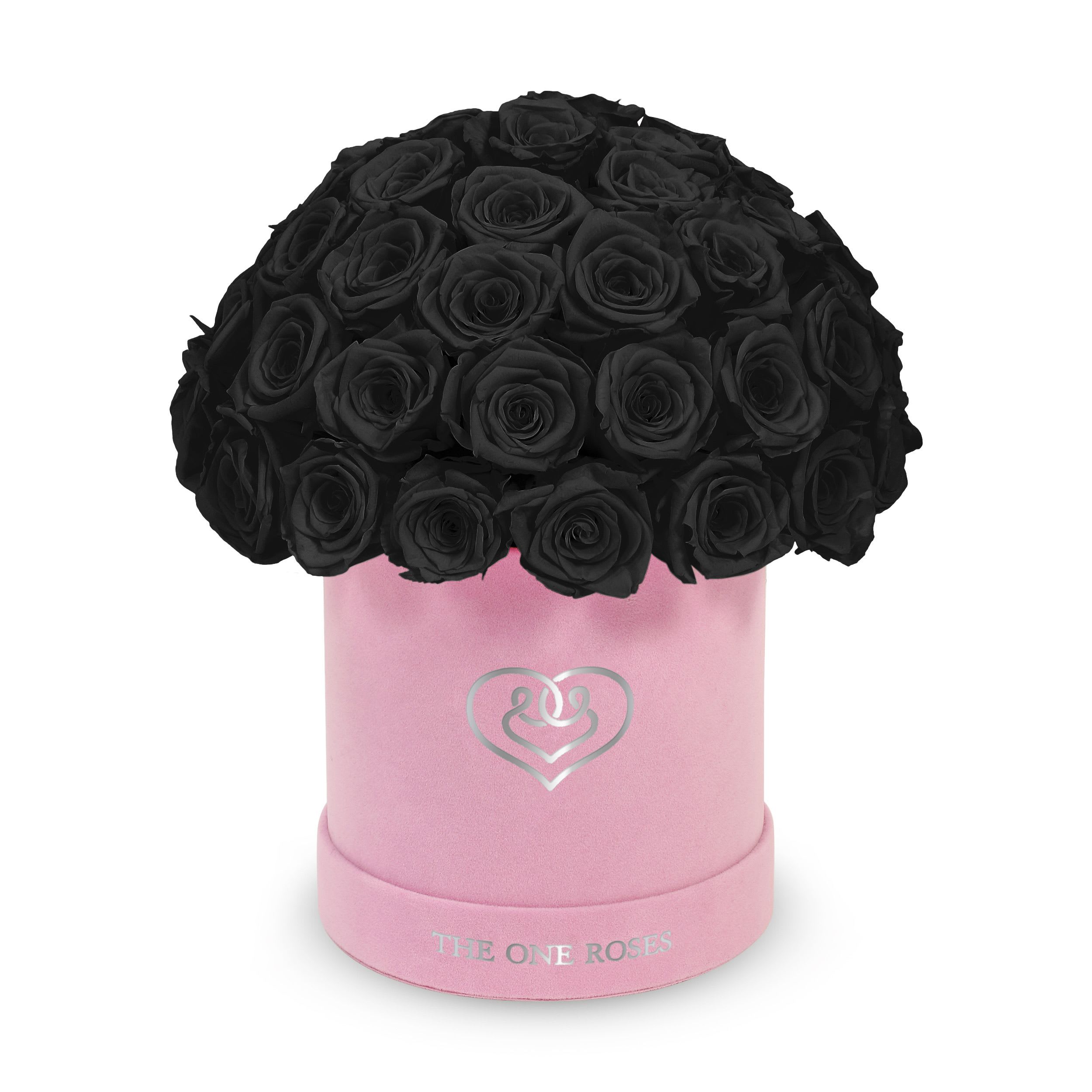 Suede Dome | Basic Pink Box Onyx Black Suede Dome | Basic Pink Box Onyx Black - The One Roses “Suede Collection“ consists of unique, real preserved roses in basic round handcrafted luxury black suede box with a top.  With about 50 stems of The One long lasting (med size) real preserved roses.  Durability: approx. 1-3 years.  Product Dimension: 6″× 6″ / ABOUT 50 ROSES  Our roses, which are carefully sourced from the highest quality gardens in Ecuador, are made to represent the eternal yet ephemeral nature of Love itself. Our Roses are specially customized with essential oils to increase the fragrance.  Product Care: DO NOT Water the roses! AVOID direct exposure to sunlight. Keep the arrangement in a room-temperature environment. If dust collects after a few months, remove it lightly using a duster. DO NOT place anything onto the roses as they can crush and damage the roses. DO NOT remove the roses from the box; they are secure and happy there. DO NOT allow roses to have direct contact with light colored fabric or surfaces, as staining may occur. The lid is meant to stay on the side or bottom of the box. Be mindful when carrying the arrangement: it's a very delicate product!