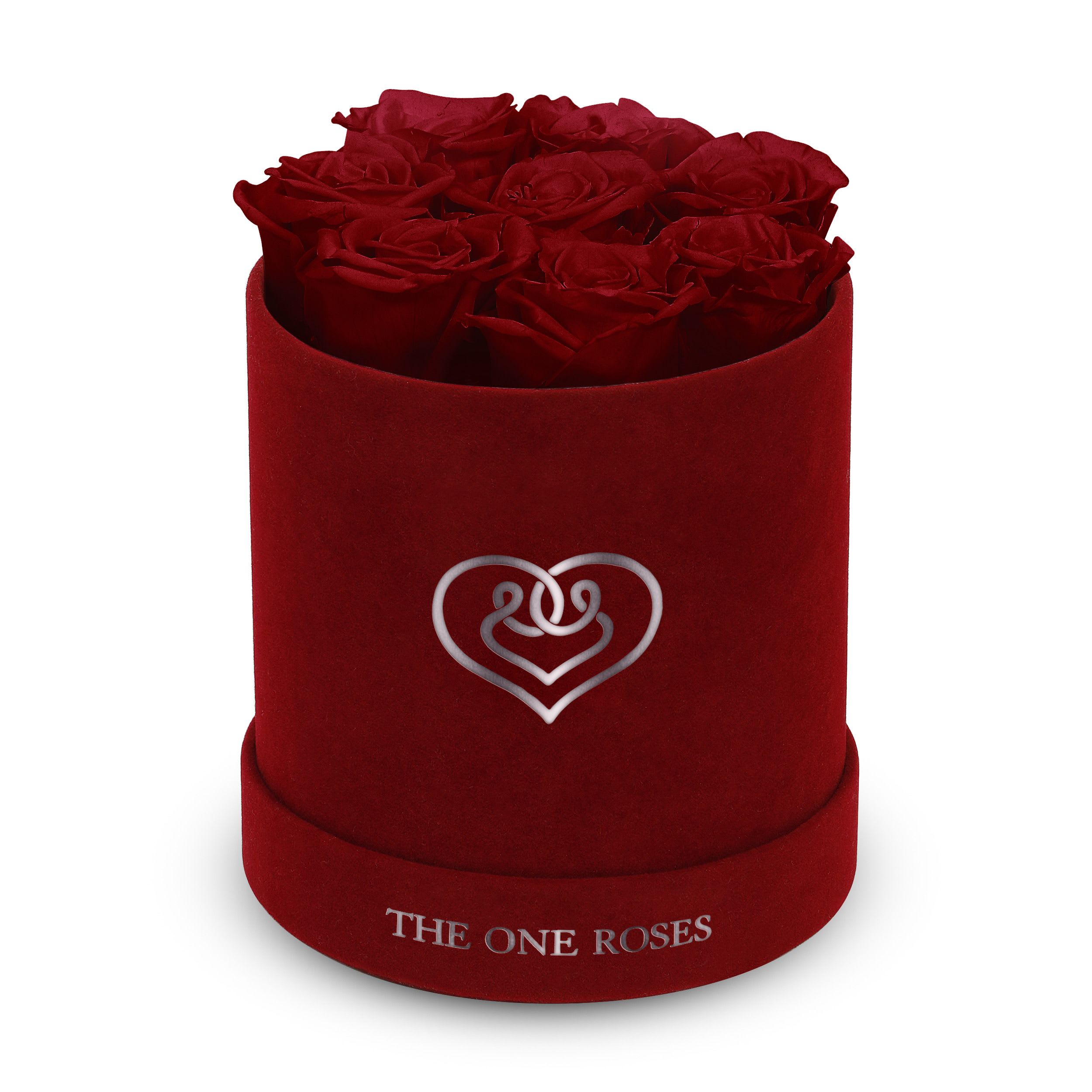Suede Flat | Basic Burgundy Box Burgundy Red Suede Flat | Basic Burgundy Box Burgundy Red - Our Burgundy-Suede Basic Box with The One Eternity Roses comes in a luxury suede hand crafted box. About 8 stems of The One long lasting (med size) preserved real roses.   Durability: approx. 1-3 years.   Product Dimension: 6″ × 6″ / 8 ROSES   Our roses, which are carefully sourced from the highest quality gardens in Ecuador, are made to represent the eternal yet ephemeral nature of Love itself. Our Roses are specially customized with essential oils to increase the fragrance.   Product Care: DO NOT Water the roses! AVOID direct exposure to sunlight. Keep the arrangement in a room-temperature environment. If dust collects after a few months, remove it lightly using a duster. DO NOT place anything onto the roses as they can crush and damage the roses. DO NOT remove the roses from the box; they are secure and happy there. DO NOT allow roses to have direct contact with light colored fabric or surfaces, as staining may occur. The lid is meant to stay on the side or bottom of the box. Be mindful when carrying the arrangement: it's a very delicate product!