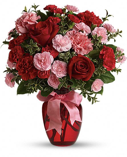 Dance With Me Dance With Me - Red roses, red and pink carnations, and pink and red mini carns in a red vase with a pink bow