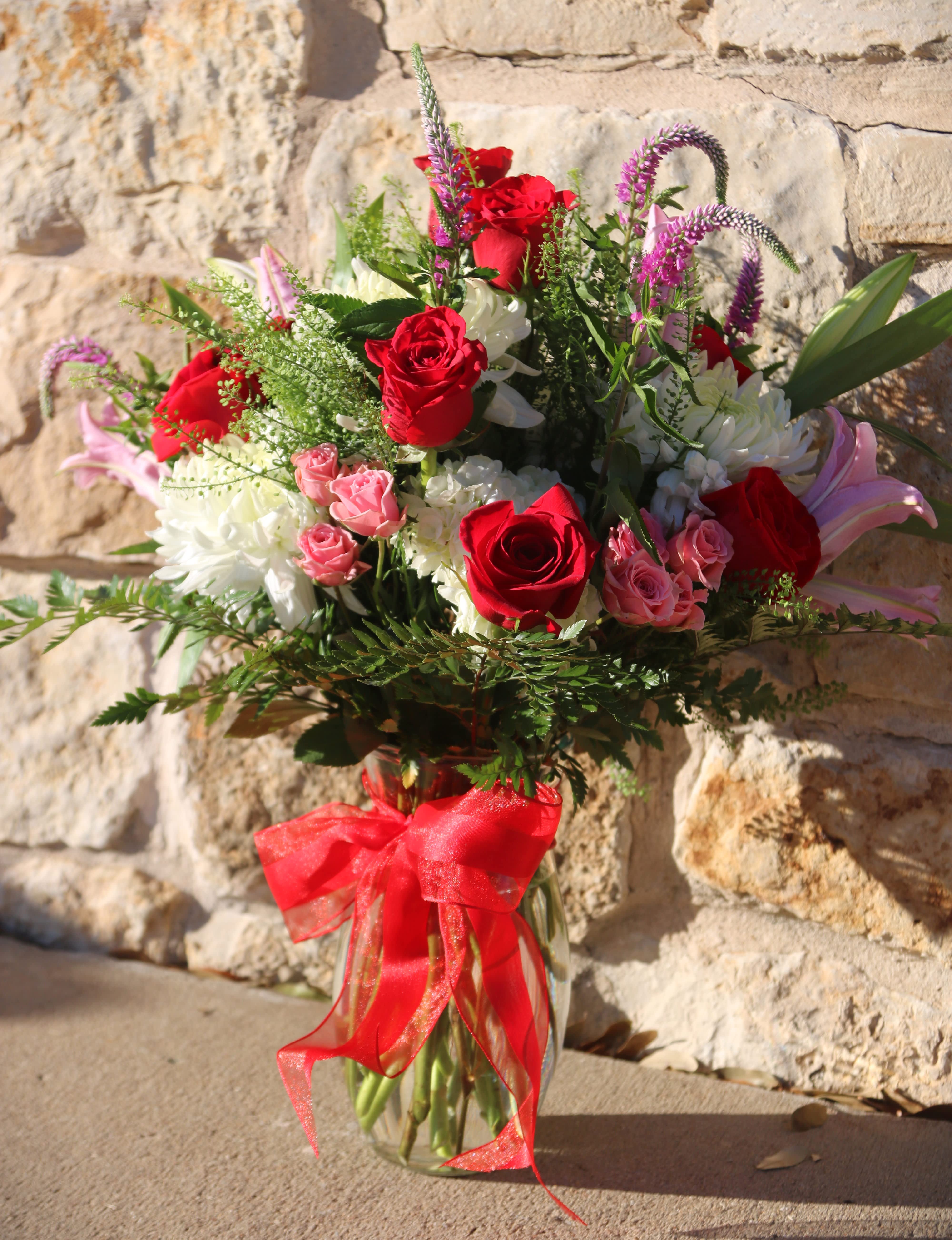 Blooming Love - Red roses with delicate touches of pink, purple, and white, perfect for blooming love.
