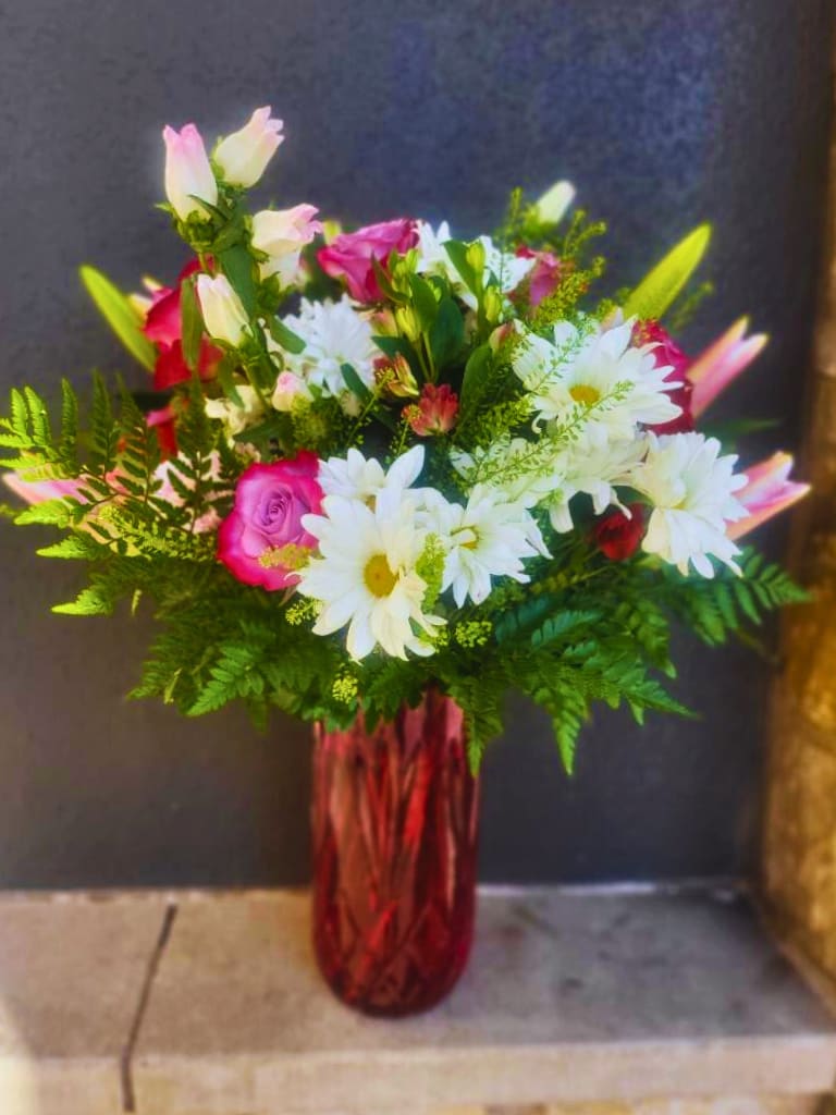 Nature's Beauty - This arrangement highlights nature’s floral beauty and wonders.  Did you know that a daisy opens its petals to embrace the sun and closes them at nightfall?