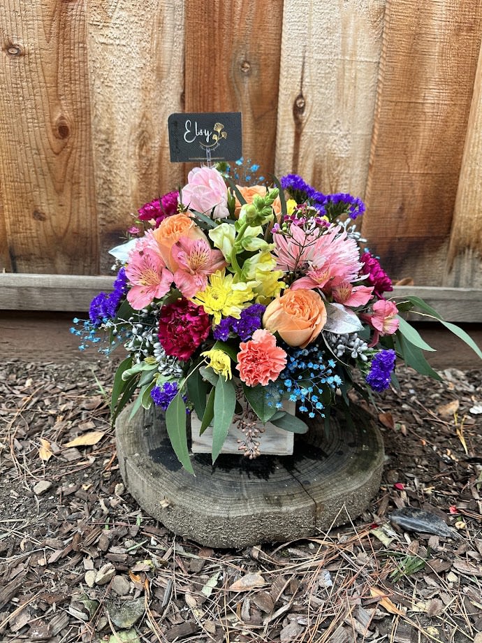 Good Light - This charming floral arrangement showcases the timeless beauty of roses paired with a variety of mixed flowers. Carefully crafted to blend soft hues and vibrant colors, it brings a fresh, natural elegance to any setting. Perfect for expressing warmth and joy, this bouquet is an ideal choice for any celebration or as a thoughtful gift to brighten someone’s day.