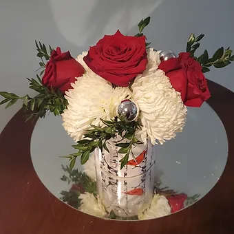 White Birch - white mums, crimson red roses and silver bells in an adorable  white birch/red cardinal ceramic container.