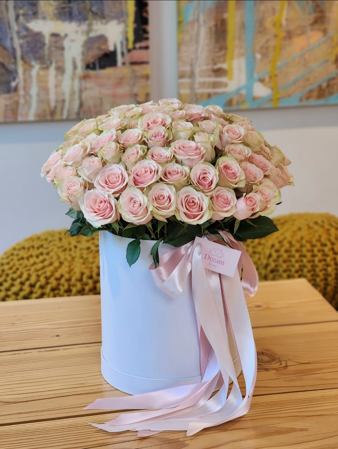 Pretty in Pink - Beauty of pink roses elegantly presented in a chic white hatbox. This stunning floral arrangement makes for an unforgettable gift or a sophisticated decor piece. Treat yourself or a loved one today!