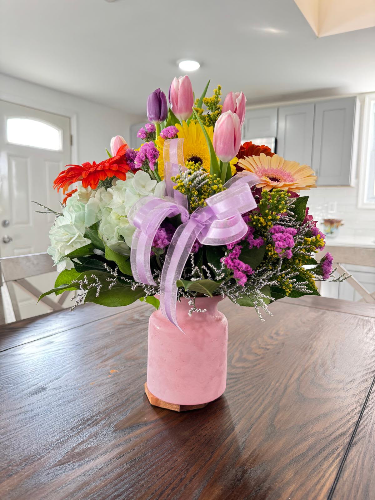 Ray of light  - Ray of Light is a charming arrangement that illuminates any space with its freshness and color. The elegance of the tulips is combined with the cheerful charm of the gerberas, creating a perfect harmony that evokes the beauty of a garden in the middle of spring. Ideal to brighten up your home or to give someone special, this arrangement is designed to convey warmth and happiness in every look.&quot;