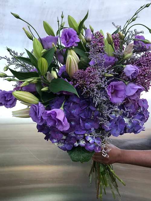 Custom Bouquet - Purple Rain Custom Bouquet - Purple Rain - Select this outstanding floral bouquet in lavenders and deep purples. Each hand-tied bouquet or custom arrangement is assembled with only the finest mix of fresh local and imported blooms. We ensure your bouquet is exquisite - no matter what size. Choose to have your flowers delivered or picked as far as a year in advance. For same-day orders, placed after 8:00AM, please call our store, 647-350-8076 to ensure your order can be processed. It can be purchased as a hand-tied bouquet or upgraded by adding our beautiful Destiny Urn +$35 small/medium + $60 Large/X-Large + $70 XXLarge Note: Due to seasonal availability and varying size options, your bouquet may appear differently than photographed. For your reference, the bouquet pictured here is Large.