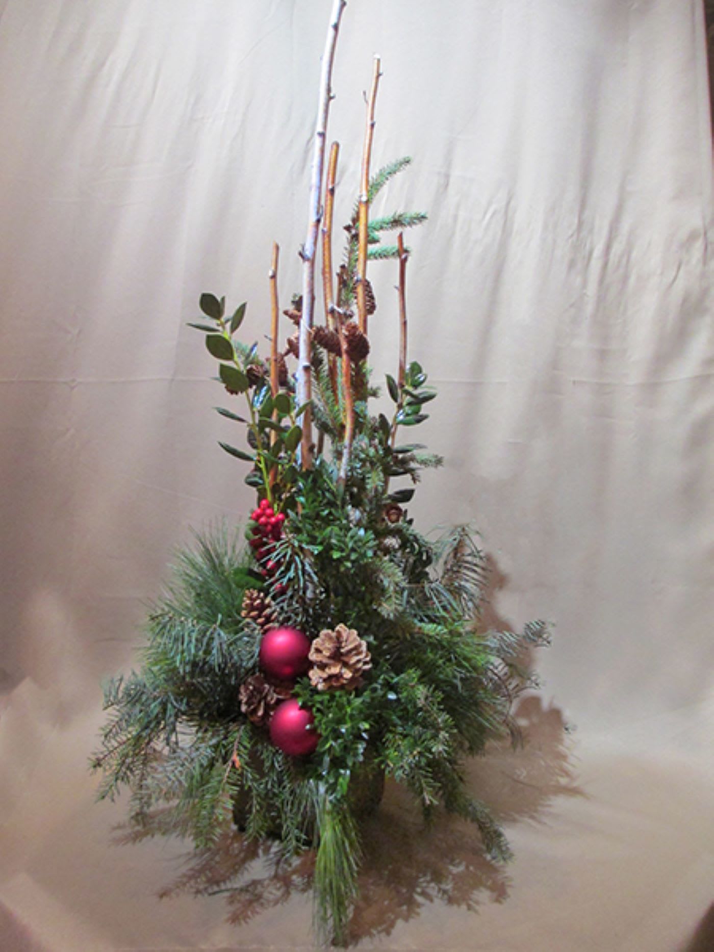 Birch &amp; Pine  - A large display of all your favorite seasonal pine greens, tall birch and accented with baubles and pinecones.
