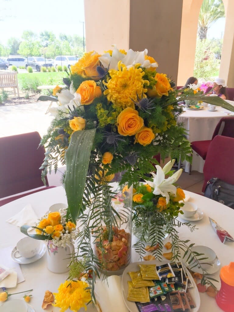 Chrysanthemum and Roses Tall Centerpiece Chrysanthemum and Roses Tall Centerpiece - Chrysanthemum and Roses Tall Centerpiece with the flower insert. This is one unique refreshing centerpiece. The vase insert can be flowers, petals or lemons. Please specify in your order. The vase height is 19,5' width 7'. With the arrangement approximate height is 25' width 15-17'.