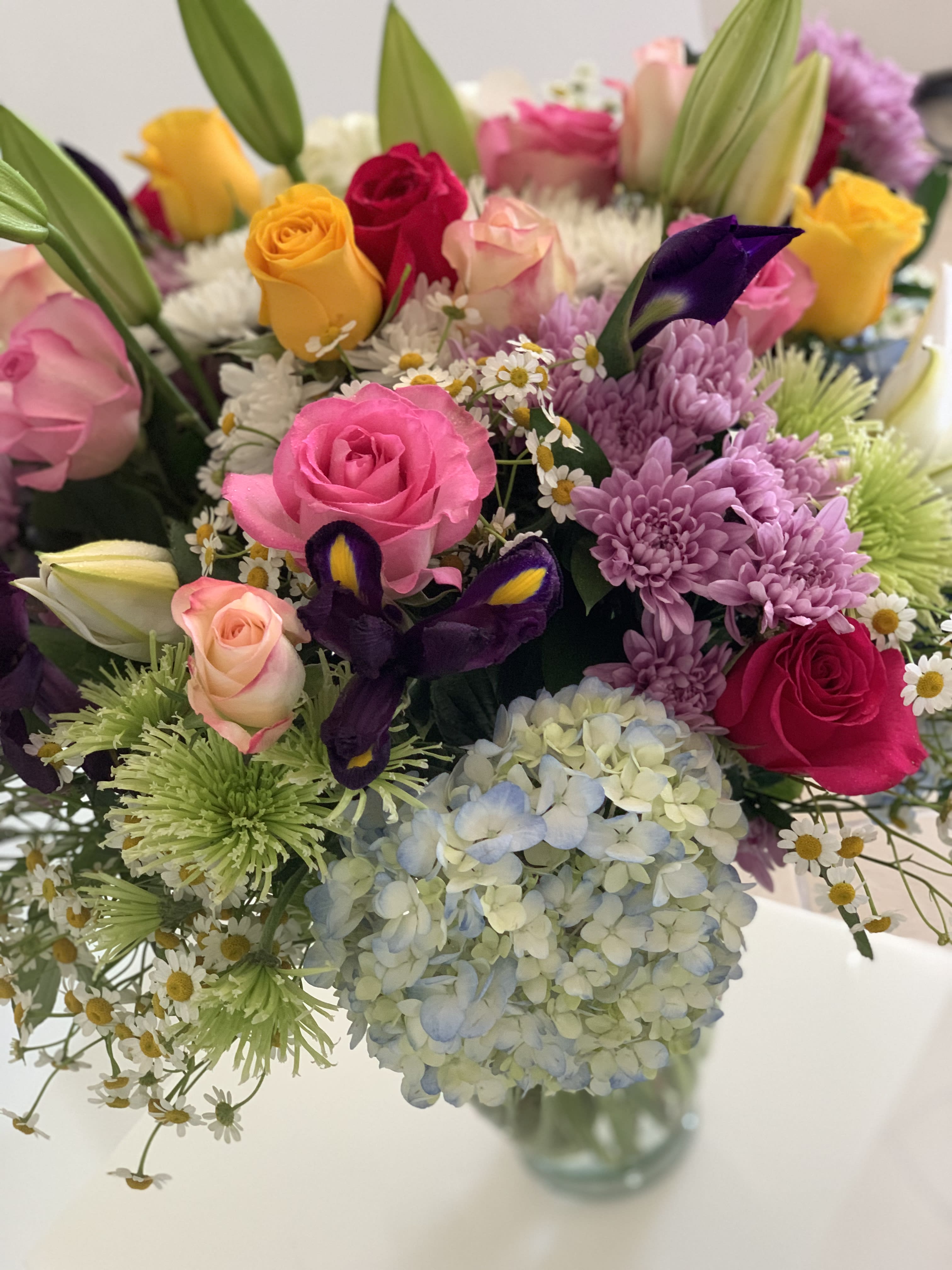 Decadent Treat - This big and tall arrangement is a very special decadent treat for your loved one. Variety of the freshest blooms graciously arranged together in a glass vase do impress  and bring high spirits. DELIVERY TIMES ARE USUALLY BETWEEN 2:30 PM THROUGH 6:30PM ON THE DAY OF DELIVERY. FOR SAME DAY ORDERS, PLEASE GIVE US AT LEAST 6 HOURS TO PROCESS AND DELIVER THE FLOWERS AS PRIOR ORDERS WILL BE PRIORITIZED. MORNING DELIVERY REQUESTS AND SPECIFIC TIME REQUESTS WILL BE AN ADDITIONAL $15 FOR A CONVENIENCE FEE CHARGE. OTHERWISE, SPECIFIC TIMES ARE ACKNOWLEDGED AND WE WILL DO OUR BEST TO ACCOMMODATE, HOWEVER WE CANNOT GUARANTEE ON TIME DELIVERY. GATE CODES ARE MANDATORY FOR OUR DELIVERY DRIVERS TO BE ABLE TO ENTER RESIDENTIAL OR COMMERCIAL BUILDINGS. IF YOU DON’T KNOW THE GATE CODE FOR A DELIVERY, PLEASE CONTACT THE RECIPIENT AND PROVIDE US WITH IT OR OUR DRIVER CAN CONTACT THE RECIPIENT BEFORE BEGINNING A DELIVERY ROUTE TO OBTAIN THE CODE. OUR POLICY STATES THAT DRIVERS WILL ONLY WAIT FIVE MINUTES OUTSIDE THE GATE FOR A CALLBACK. IF A DRIVER HAS TO LEAVE A PROPERTY, THE DELIVERY IS REASSIGNED FOR THE NEXT DAY AND MAY CHARGE AN ADDITIONAL DELIVERY FEE. THANK YOU FOR YOUR BUSINESS!