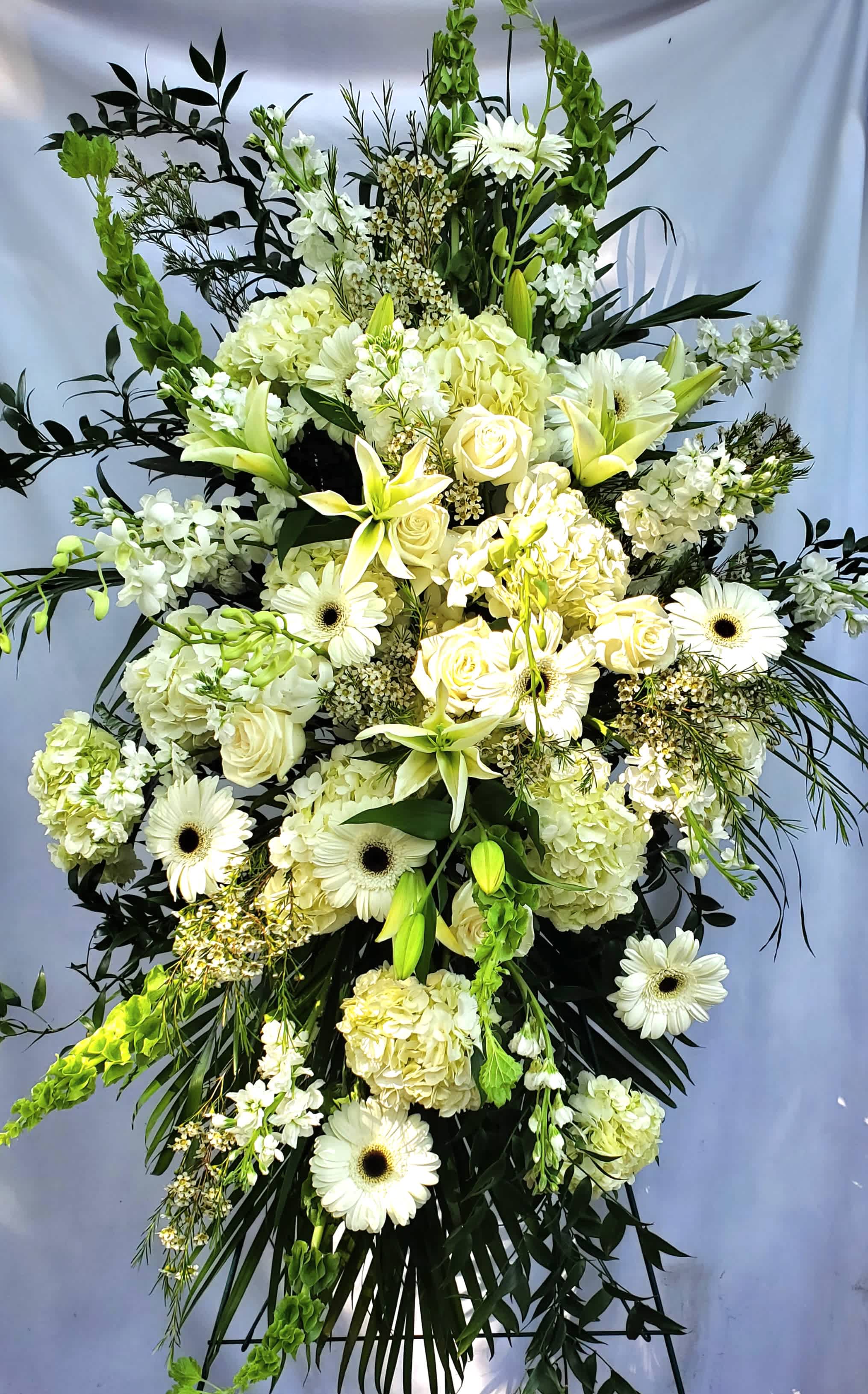 Sympathy Standing Spray - CALL 912.638.7323 TO DISCUSS OPTIONS! - Shown in all white  but available in any color combination you desire. CALL 912.638.7323 TO DISCUSS OPTIONS! This standing funeral spray is a wonderful remembrance for a life well lived. Featuring premium flowers and garden greenery from our large selection, this elegant funeral spray brings comfort to those experiencing sorrow.  