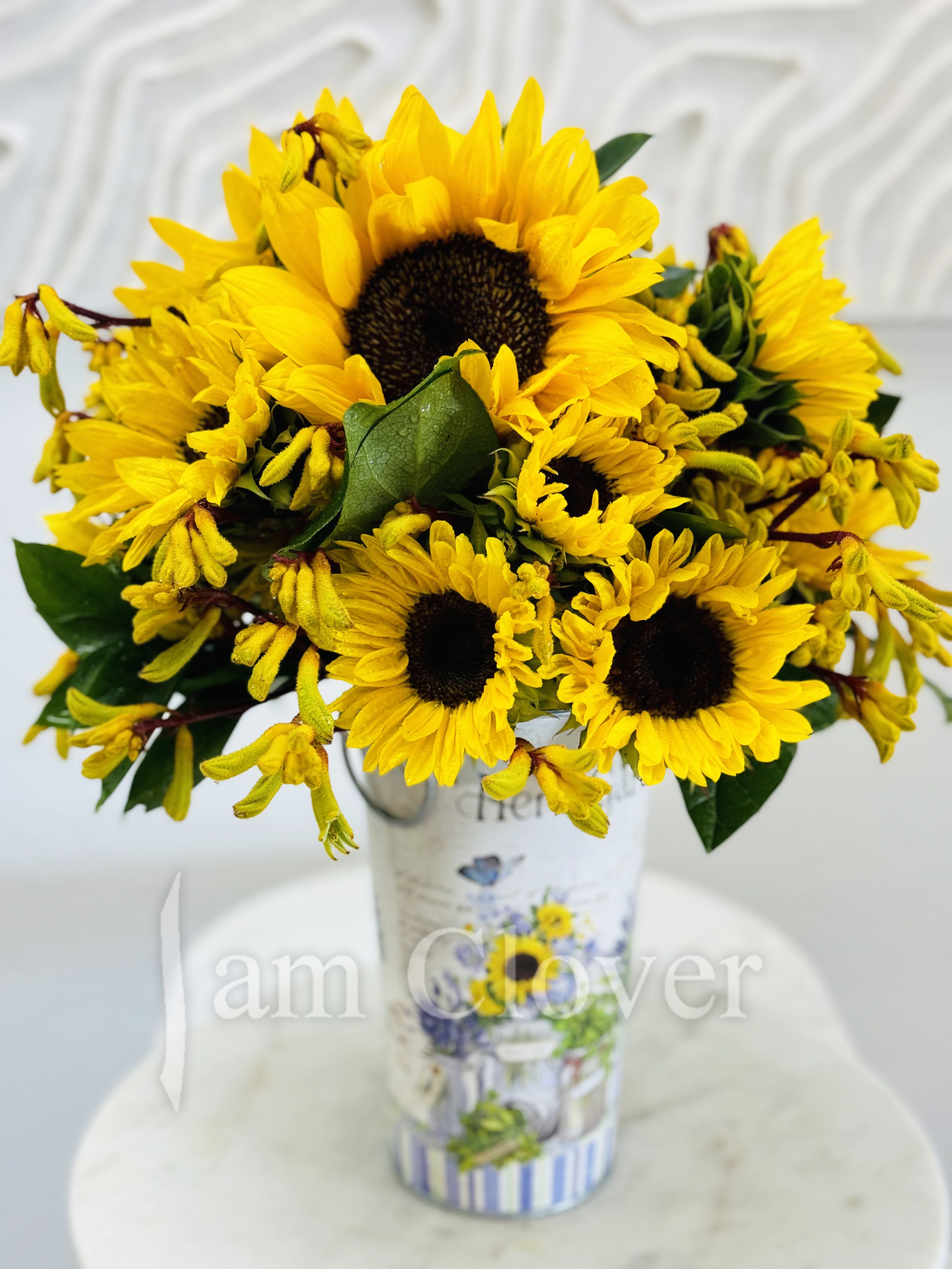 Sunflower Sunshine  - Bring some sunshine into your home or office. It’s an elegant arrangement with a flare of optimism.   Fulfill your floral needs at I Am Clover in Ramona, CA, and experience the difference in quality, freshness, and care that comes with ordering locally. By choosing a local florist, you’re ensuring that each bloom is handpicked at the peak of its beauty, arriving at your doorstep or event in perfect condition. I Am Clover works with the finest, seasonal blooms, meaning your arrangement is as fresh as possible—often sourced directly from nearby growers. 