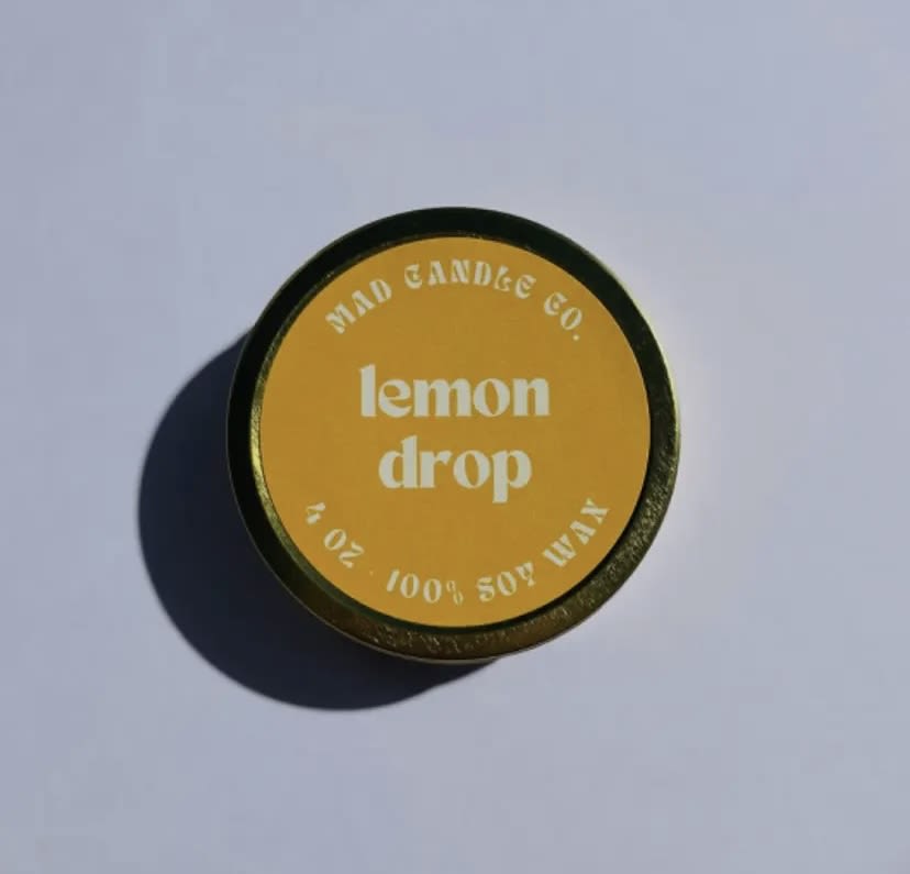 Lemon Drop Soy Candle - 4 oz Gold Tin & Wood Wick Lemon Drop Soy Candle - 4 oz Gold Tin & Wood Wick - Journey to sun-kissed days with our exhilarating Lemon Drop candle. Packed with energizing hints of freshly squeezed lemon and warm sugary sweetness, finished off with refreshing mint. Notes: Zesty lemon, sweet sugar, refreshing mint, and warm tonka bean. PRODUCT DETAILS -4 oz / Burn time: 15 hours / Dimensions: 3.25" L x 3.25" W x 1.25" H -Sustainable crackling wood wick that sounds like a cozy fireplace -Vegan, Cruelty-free, Non-toxic, Paraben-free & Phthalate-free -Hand-poured in Eugene, Oregon