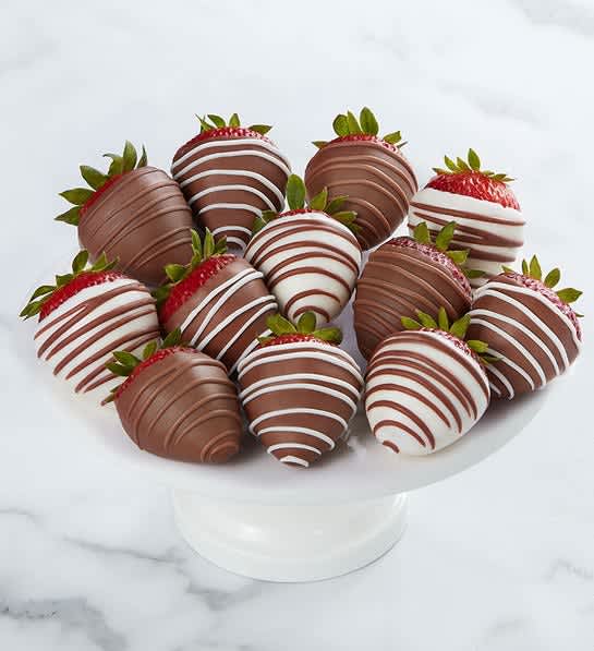 Love and Romance™ Dipped Strawberries - These plump juicy strawberries dipped and drizzled to perfection are the perfect romantic gesture. Have to give two days notice. The strawberries may not be the same design. 