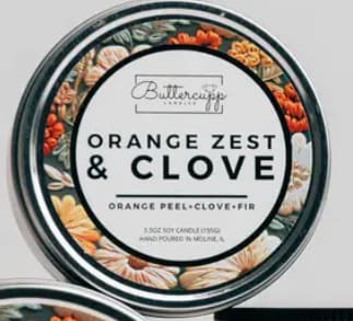 Orange Zest & Clove Winter Soy Candle Tin 5.5oz Orange Zest & Clove Winter Soy Candle Tin 5.5oz - A Buttercupp exclusive scent blend It makes us think of decorating oranges with cloves near a cozy fire! Scent Notes: Top: Orange Peel, Cinnamon, Ginger Middle: Cypress, Berry, Apple, Clove Bottom: Cedar, Pine, Fir, Pecan