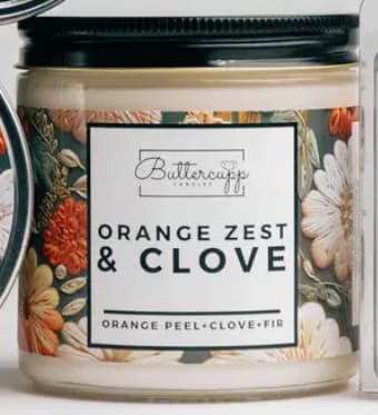 Orange Zest & Clove Winter Soy Candle Jar Orange Zest & Clove Winter Soy Candle Jar - A Buttercupp exclusive scent blend It makes us think of decorating oranges with cloves near a cozy fire! Scent Notes: Top: Orange Peel, Cinnamon, Ginger Middle: Cypress, Berry, Apple, Clove Bottom: Cedar, Pine, Fir, Pecan