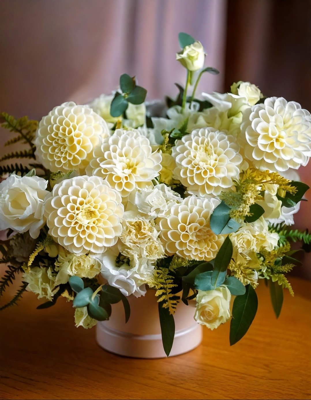 Pure Elegance Dahlia Pure Elegance Dahlia - Experience the elegance of our exquisite ivory dahlia and white rose arrangement, meticulously crafted to elevate any space with its timeless beauty. Perfect for weddings, anniversaries, or luxury home decor.