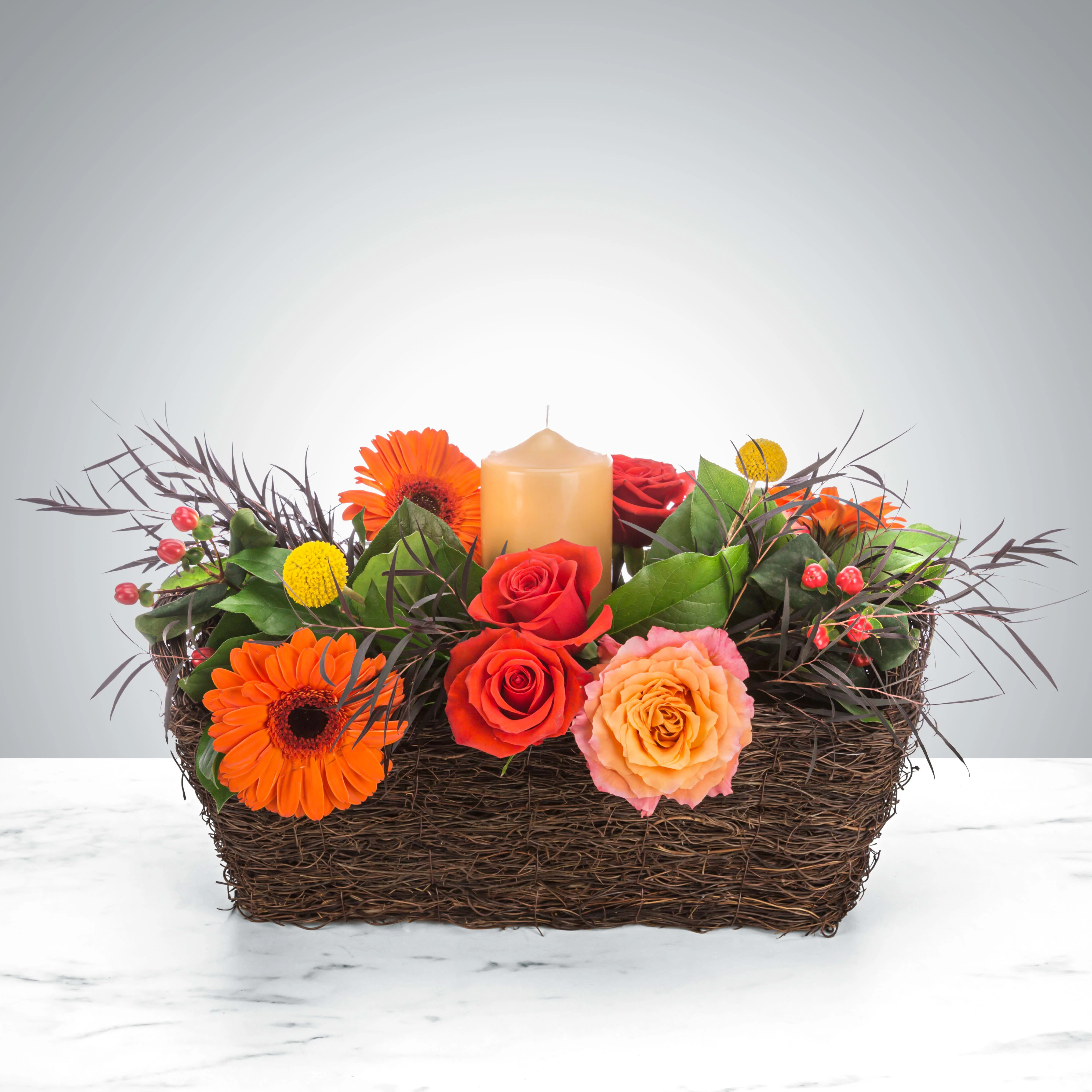 Harvest Equinox by BloomNation™ Harvest Equinox by BloomNation™ - A perfect autumn dinner party centerpiece, this arrangement features roses, daisies, and a center candle. Perfect for Thanksgiving, a Halloween dinner, or Rosh Hashanah. Approximate Dimensions: 14"D x 10"H