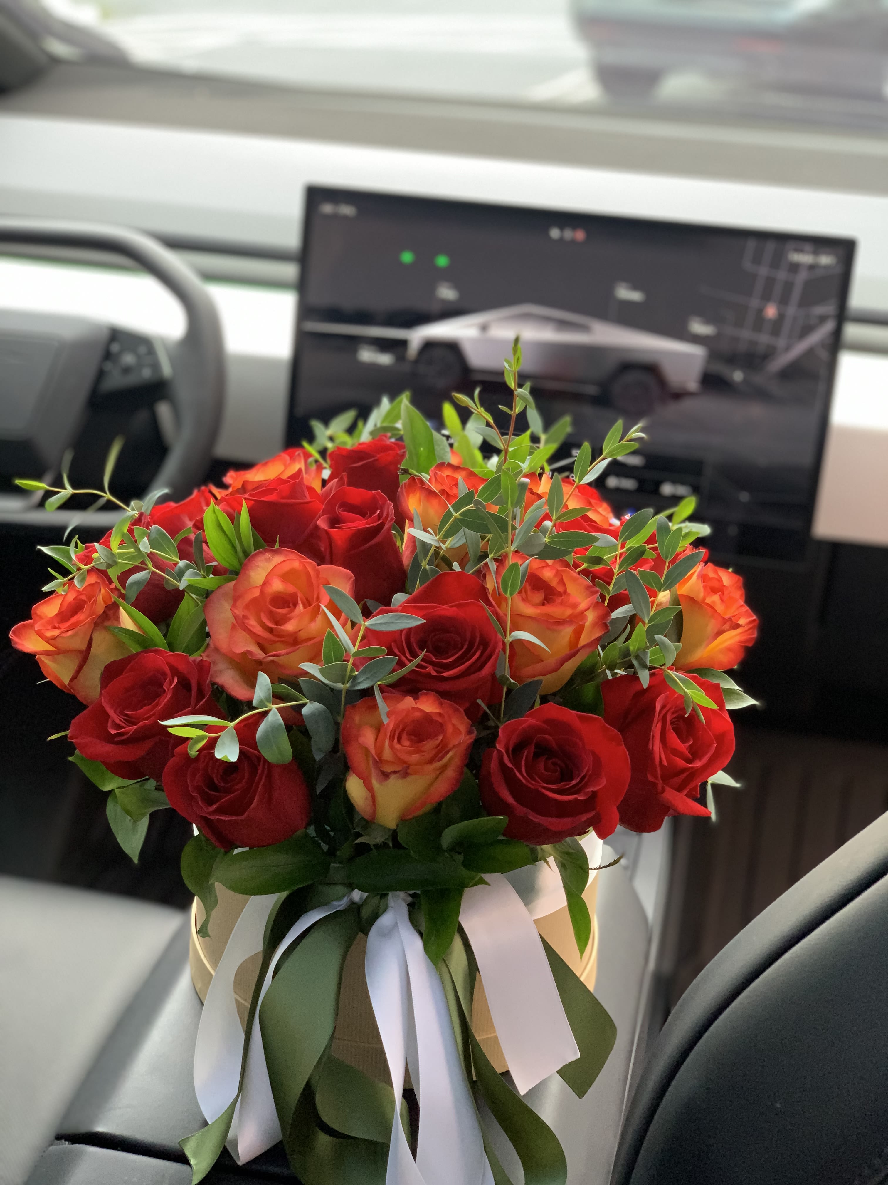Fall Roses - Our Fall owes in a modern box simple and elegant.  Our arrangement is filled with 35 Roses of warm Fall colors with a hint of Eucalyptus, finished with a satin ribbon. 