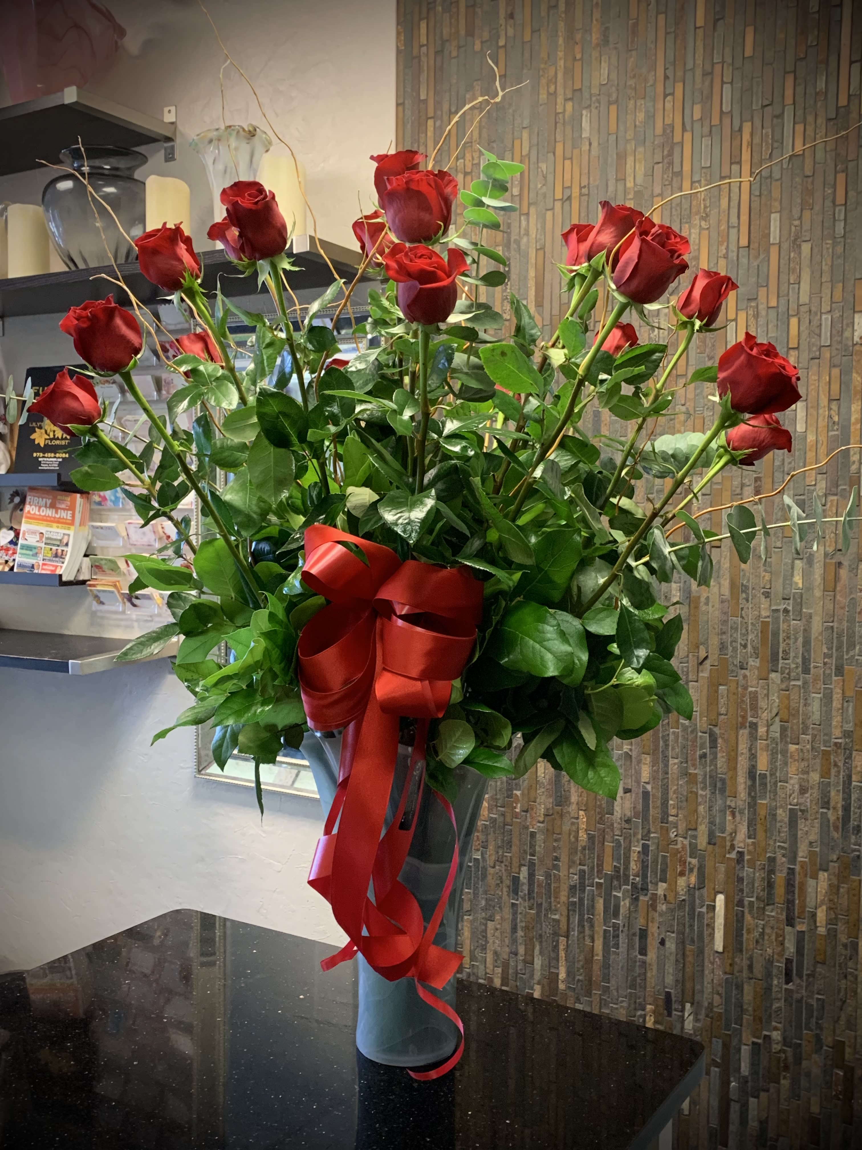 Arrangement of Roses - An arrangement of 80CM Roses is the perfect gift for that special someone in a Milano vase.