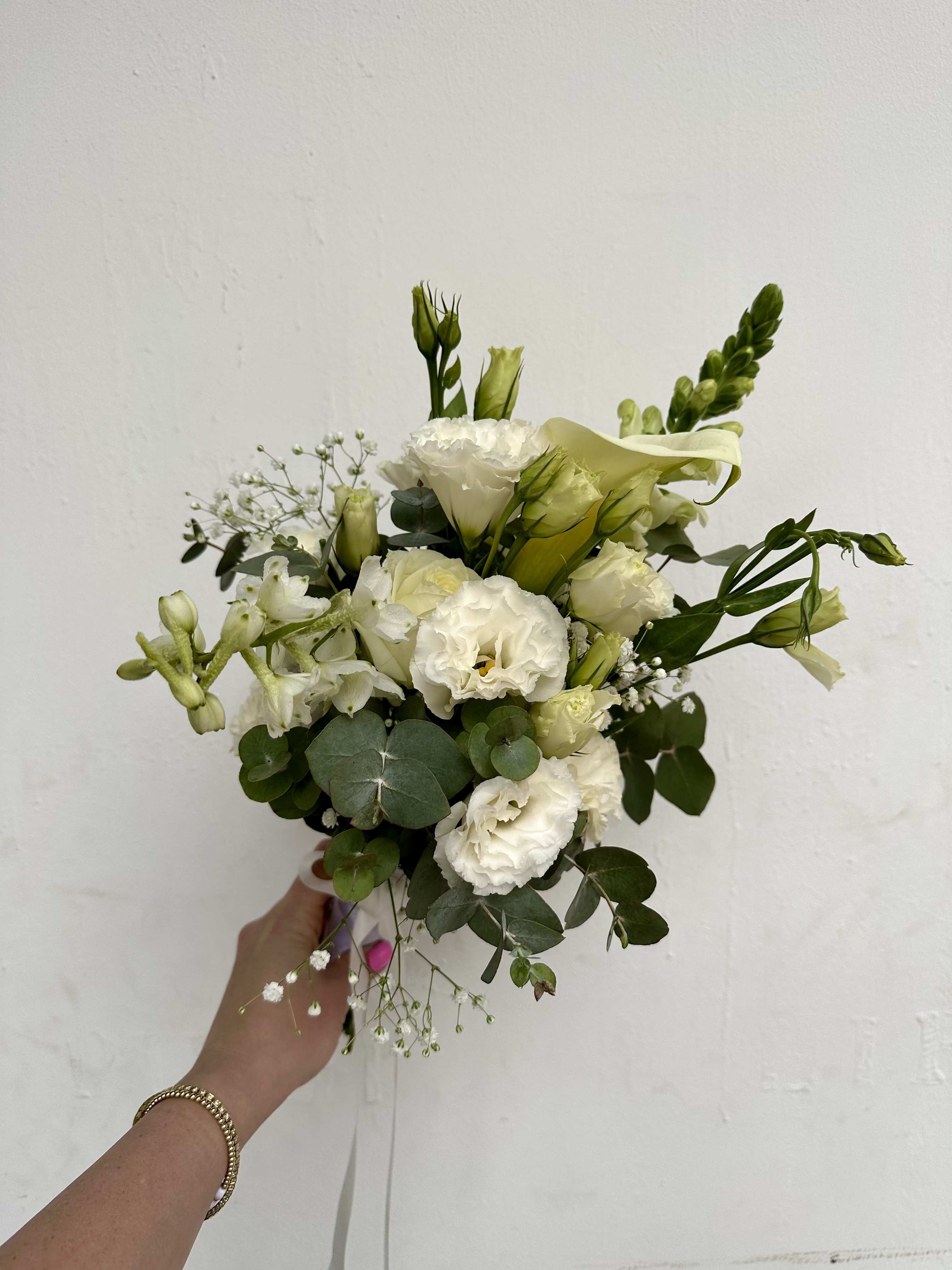 Mix Flowers Bridal Bouquet  - Bridal bouquet with special touch!  Upgrade your big day with mix of luxury blooms.  We are dedicated to our floral arrangement and want you to get the bouquet in its best condition so we are adding a suitable vase to carry the bouquet while it's making its way to the ceramony, so you will enjoy the bouquet as it just left our studio!  Arrangement includes: - Fresh roses - Floral vase 