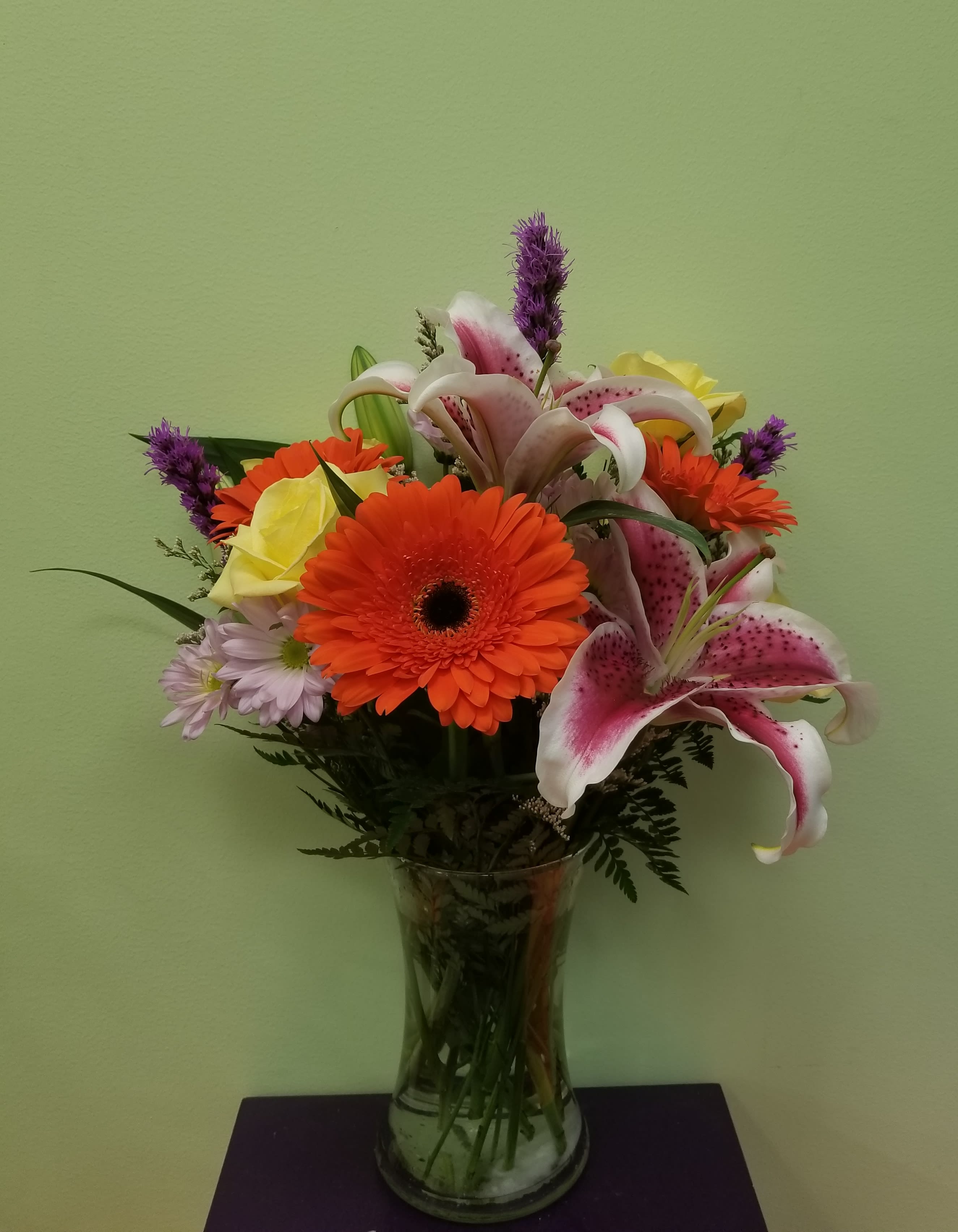 Summer Lovin' - Get ready for the lovely summer!! Enjoy this beautiful arrangement of bold colors and flowers including Stargazer Lilies and Gerber Daisies.  