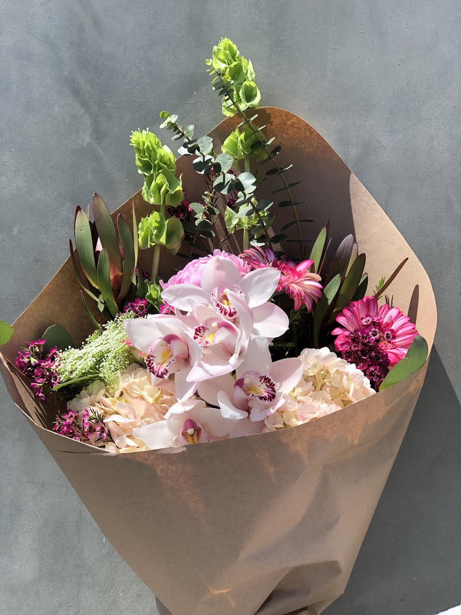 Soft Pink Orchid Soft Pink Orchid - SAFARY, BELLS OF IRELAND,EUCALIPTHUS, HYDRANGEAS, ORCHID, WRAPT IN BROWN PAPER.