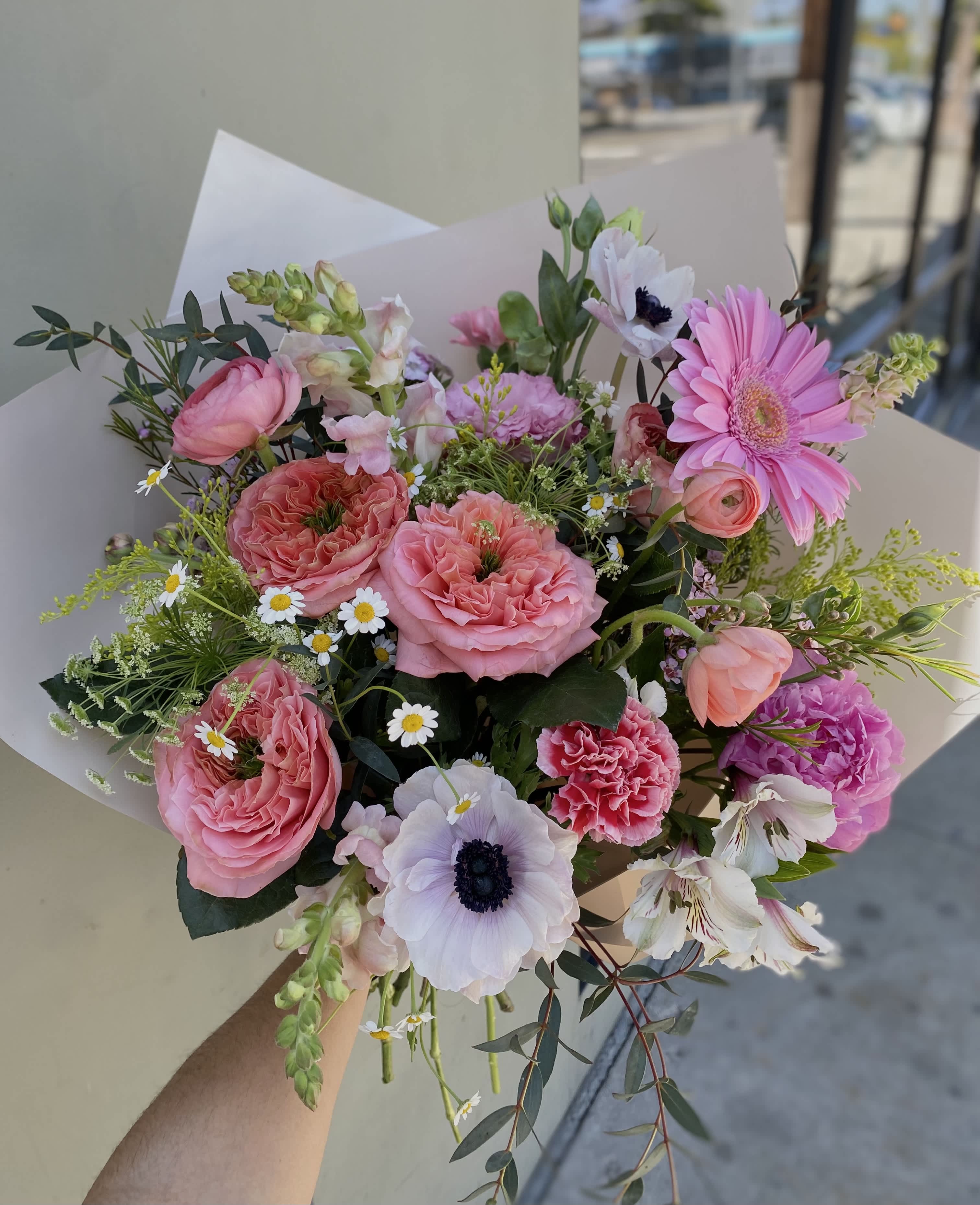 Rosey Rosey - includes ranunculus, garden roses, anemones, carnations, gerbera daisies, wax flowers