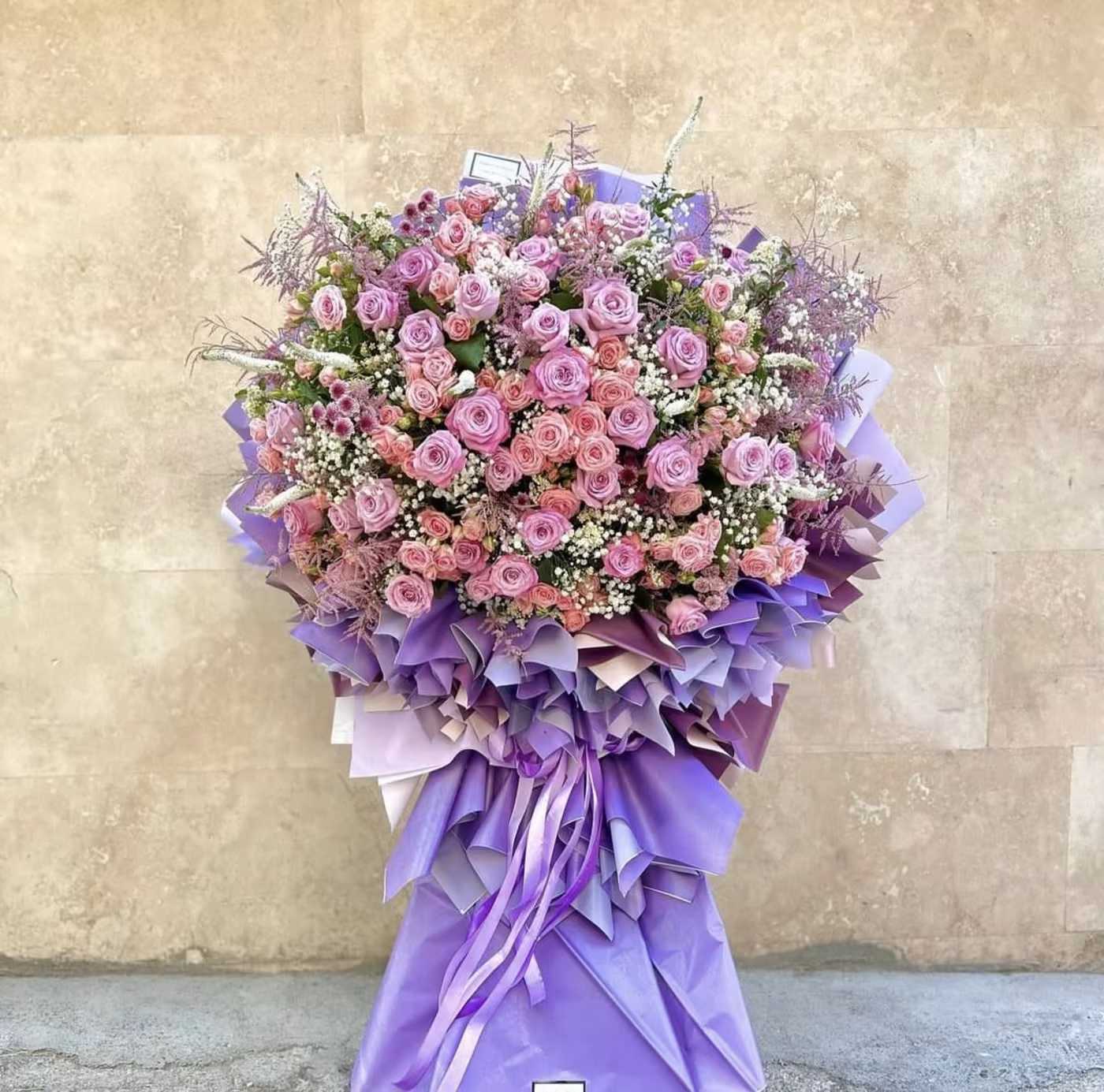 Statement - Simi Valley Florist Statement - Simi Valley Florist - The "Statement" bouquet is a strikingly beautiful arrangement that captures the essence of elegance and charm. Featuring a delicate mix of peach and pink roses, this bouquet radiates warmth and sophistication. The peach roses add a soft, inviting glow, while the pink roses bring a romantic and timeless touch. Accented by the light and airy baby’s breath, this bouquet offers a perfect balance of color and texture. The "Statement" bouquet is an exquisite choice for celebrating milestones, expressing heartfelt emotions, or simply making a graceful impression on any occasion.