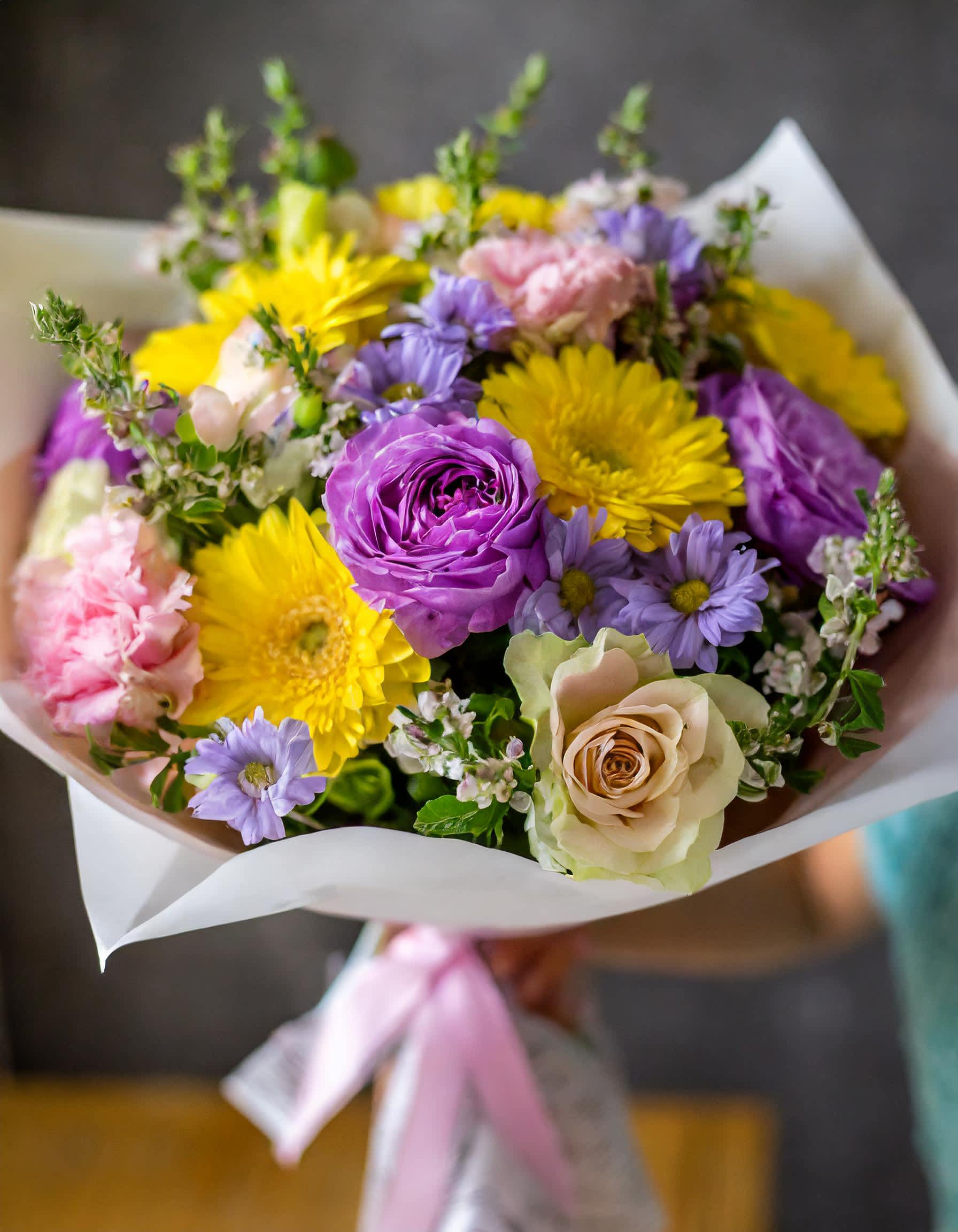Romantic Bouquet - Our stunning bouquet featuring of sunny yellow gerberas, purple roses, and an array of captivating mixed flowers. Elevate any occasion with this enchanting floral arrangement, designed to delight and dazzle.  Recommended for:  Love and Romance, I Love You Flowers, Anniversary, Proposal,  Romantic Gift, Birthday, Get Well Soon, Celebrations, Best Wishes, Thank You, Congratulations, Just Because, New Baby, Everyday, Mother's Day