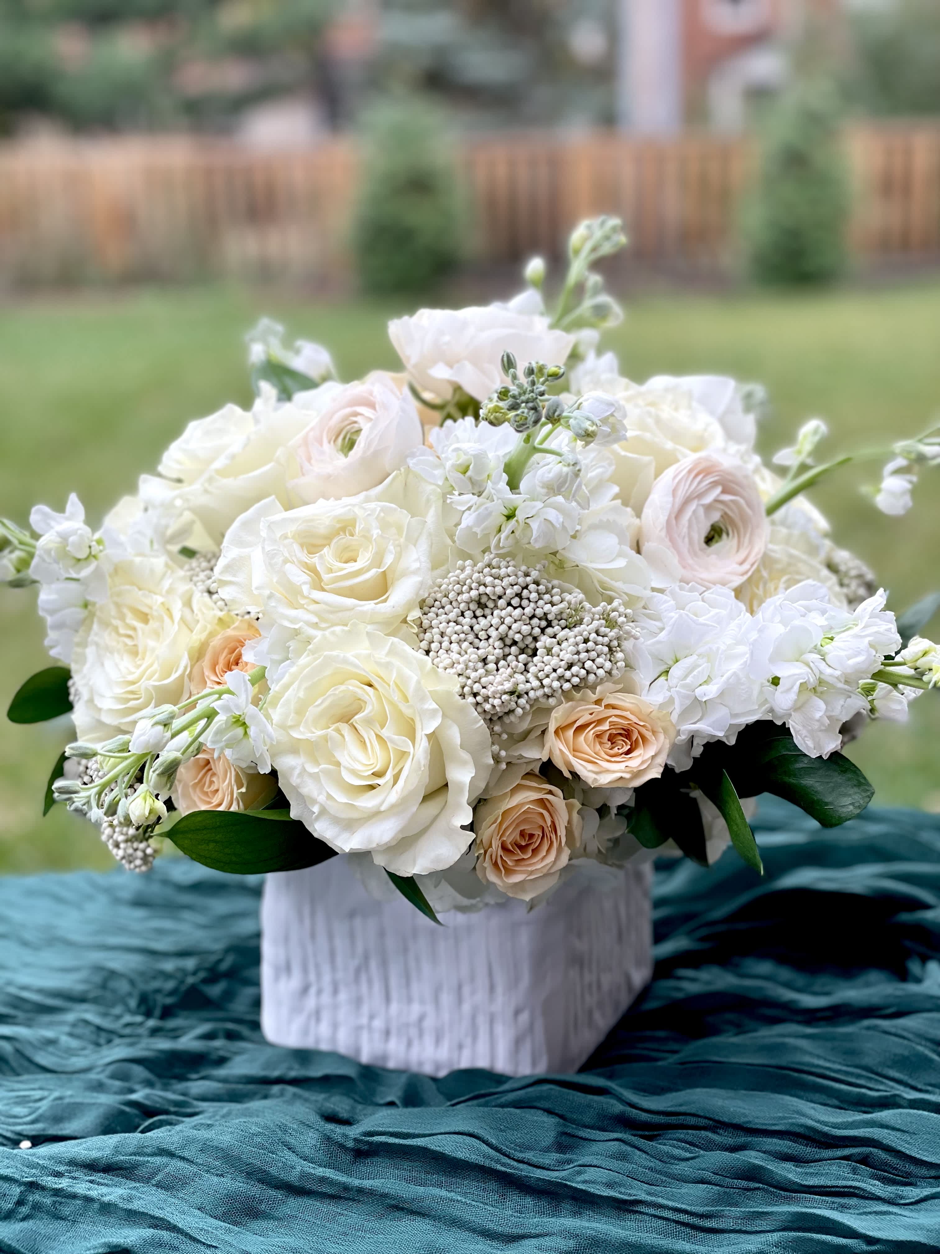 Vanilla Latte - A neutral pallet of roses, ranunculus, stock and spray roses. Perfect for any type of occasion. 