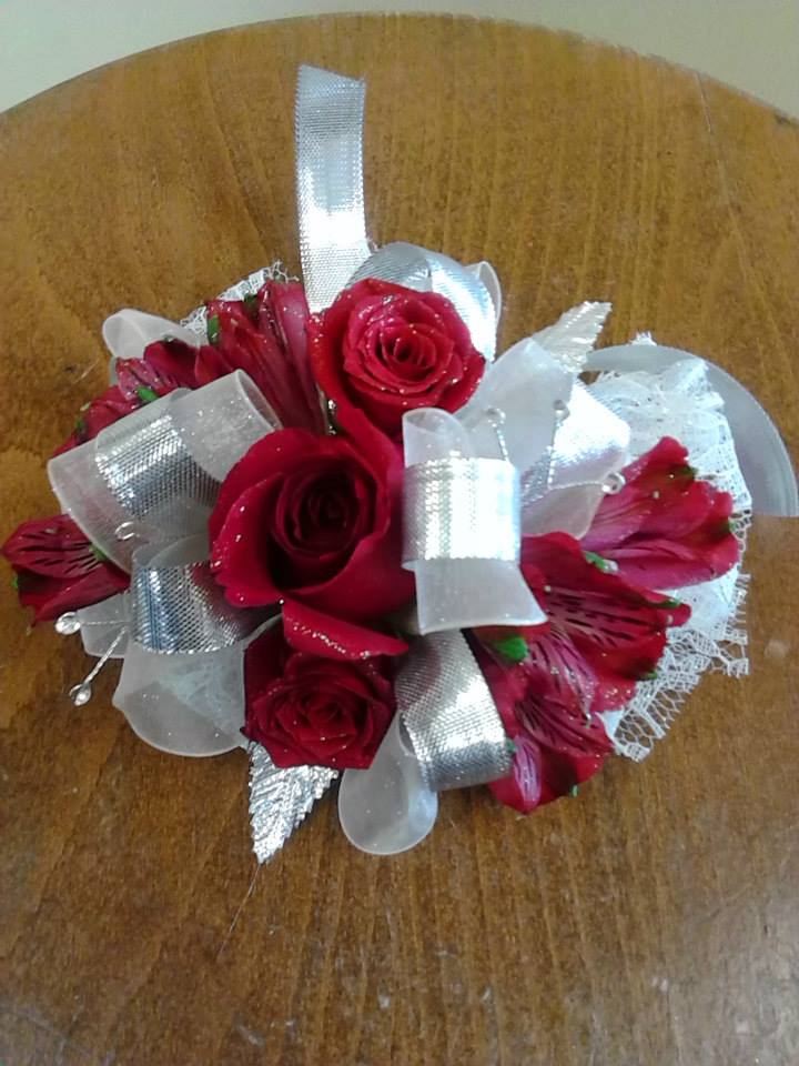 Wonderful Tonight Corsage - In The words of Eric Clapton &quot;Yes, you look wonderful tonight&quot; Start the night out right, beautifully opened red spray roses sit atop a bed of silver and white ribbon with red alstromariea peeking out with rhinestones (other colors available