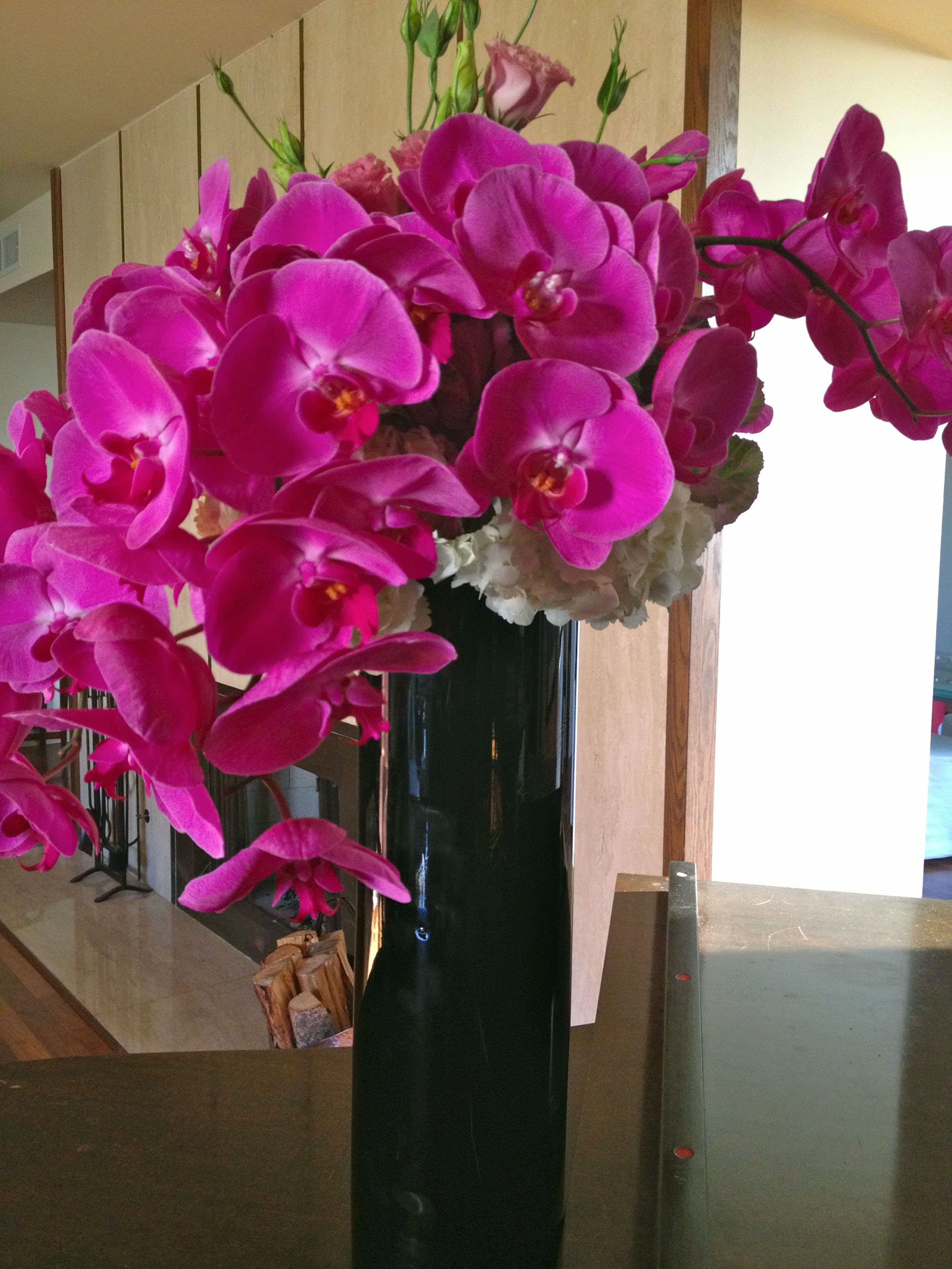 269 Cascading Orchids - Stunning Cascading Floral Arrangement by T'sul Custom Floral Design in Newport Beach, CA  Elevate your floral decor with T'sul Custom Floral Design’s exquisite display of long-stemmed cascading orchids, lisianthus, and hydrangeas, available in elegant shades of purple or white. Perfect for weddings, special events, or simply to beautify your home, this breathtaking arrangement showcases the beauty and versatility of premium flowers.   At T'sul Custom Floral Design, we pride ourselves on providing personalized floral creations that reflect your unique style. Each arrangement is crafted with care, using only the freshest blooms, ensuring a stunning presentation every time. Color availability may vary, so be sure to contact us for the latest options!  Order your enchanting cascading floral display today and let T'sul Custom Floral Design brighten your Newport Beach home or special occasion with sophisticated elegance. Experience the difference of customized floral artistry that’s just a call away!