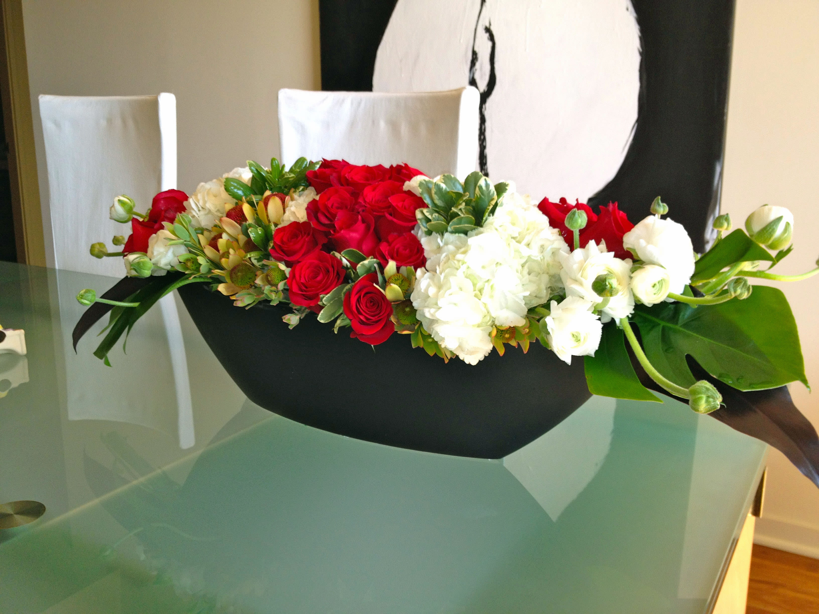 169 Medium 12 Rose Boat (Large in photo-24) - Medium Floral Boat Arrangement with 12 Roses from T'sul Custom Floral Design in Newport Beach, CA  Enhance your space with our stunning Medium Floral Boat Arrangement, featuring 12 elegant roses paired with an assortment of fresh seasonal flowers, exclusively from T'sul Custom Floral Design in Newport Beach, CA. This beautifully crafted arrangement offers a perfect balance of color and elegance, making it an ideal centerpiece for any occasion.  Whether you’re celebrating a birthday, anniversary, or simply looking to brighten your home or office, our Medium Floral Boat Arrangement is designed to impress. For those who desire a more extensive option, consider our Large Boat Arrangement, photographed here, which features an impressive 24 roses at $199.  Key Features:  Medium arrangement includes 12 premium roses and a variety of fresh seasonal blooms Perfect for home decor, special events, or as a thoughtful gift Available in vibrant color options to match your aesthetic Locally sourced flowers ensure freshness and quality Transform your environment with T'sul Custom Floral Design’s Medium Floral Boat Arrangement. Order today to bring a touch of beauty and sophistication to your Newport Beach home or event!
