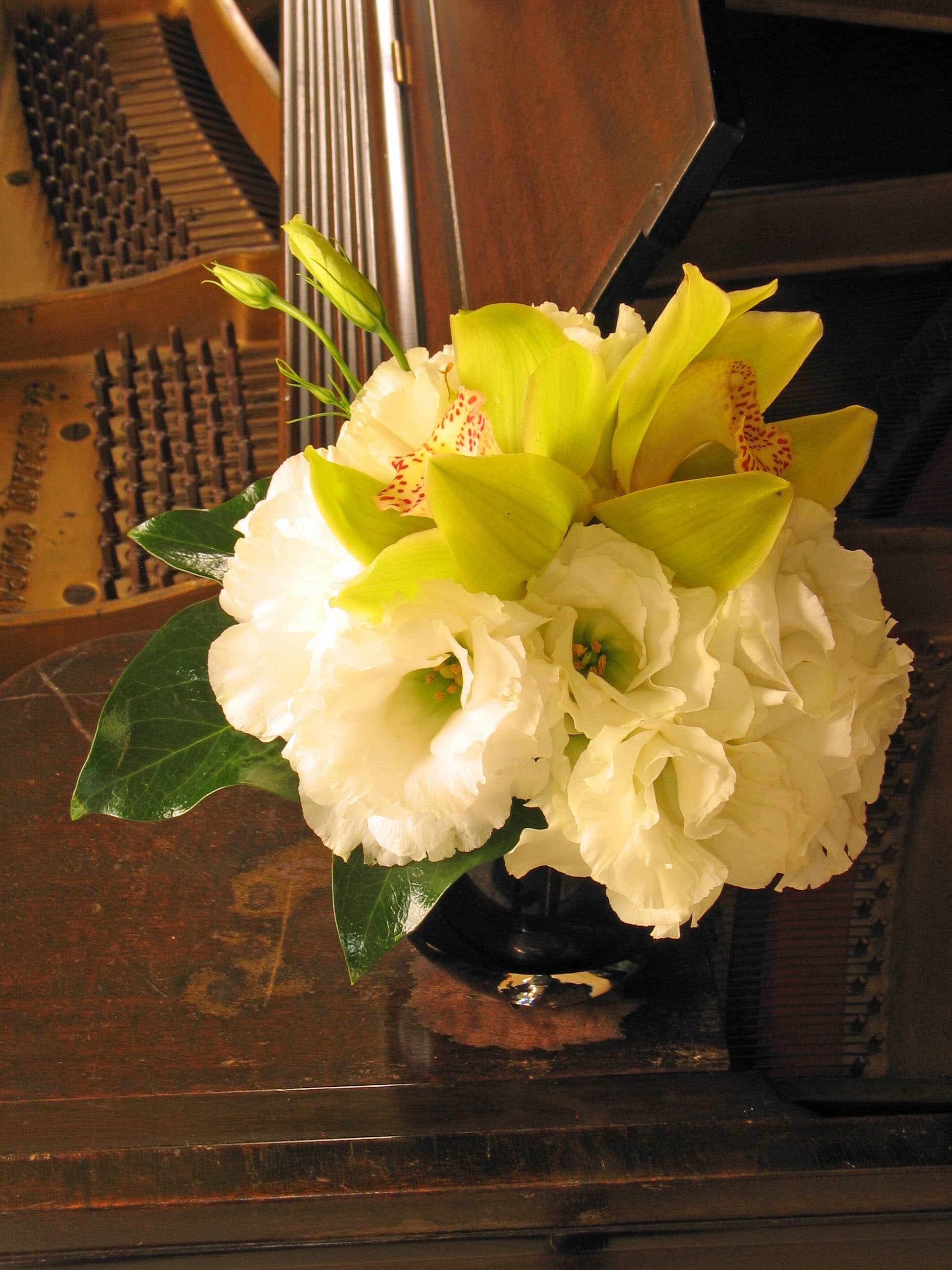 59- Orchid Desktop &quot;Small is Beautiful&quot; - Cymbidium Orchids Arrangement with Lisianthus and Fresh Greens from T'sul Custom Floral Design in Newport Beach, CA  Elevate your floral decor with our stunning arrangement of Cymbidium orchids nestled within delicate lisianthus and lush greens, exclusively crafted by T'sul Custom Floral Design in Newport Beach, CA. This elegant display combines the exotic beauty of Cymbidium orchids with the soft charm of lisianthus, creating a visually striking centerpiece that enhances any space.  Perfect for home decor, special events, or as a thoughtful gift, this arrangement is designed to impress. The combination of vibrant orchid blooms and the gentle elegance of lisianthus, complemented by fresh greens, offers a sophisticated look that is sure to delight anyone who sees it.  Key Features:  Beautifully arranged Cymbidium orchids paired with soft lisianthus and vibrant greens Ideal for enhancing your home decor, weddings, corporate events, or gifting Crafted with fresh, high-quality flowers for lasting beauty and fragrance A perfect choice for adding a touch of elegance to any setting Transform your Newport Beach space with T'sul Custom Floral Design’s exquisite Cymbidium orchids nestled in a bed of lisianthus and greens. Order today to bring the beauty of fresh flowers into your life!