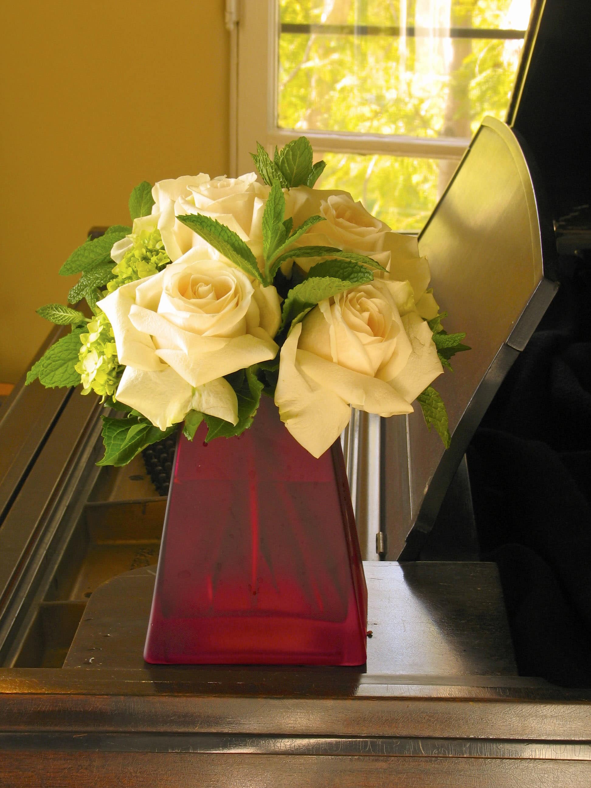 79 Rose tower - Tower of Roses Surrounded by Fresh Mint or Rosemary from T'sul Custom Floral Design in Newport Beach, CA  Transform your floral decor with our stunning Tower of Roses, expertly arranged and surrounded by fragrant fresh mint or rosemary, exclusively at T'sul Custom Floral Design in Newport Beach, CA. This eye-catching arrangement showcases the elegance of premium roses while adding a delightful herbal accent that elevates its beauty and aroma.  Perfect for any occasion, whether it’s a romantic gift, special event, or simply to brighten up your home, this tower of roses makes a bold statement that captures attention. The combination of lush, vibrant roses with aromatic herbs creates a striking visual and sensory experience that is sure to impress.  Key Features:  Elegant tower of freshly cut roses, arranged to create a stunning focal point Surrounded by fresh mint or fragrant rosemary for an added burst of aroma Ideal for weddings, anniversaries, home decor, or as a thoughtful gift Crafted with high-quality, locally sourced flowers to ensure freshness and longevity Bring a touch of elegance and a delightful fragrance into your Newport Beach home with T'sul Custom Floral Design’s mesmerizing Tower of Roses. Order today to enjoy the beauty of fresh flowers that enhance any occasion!